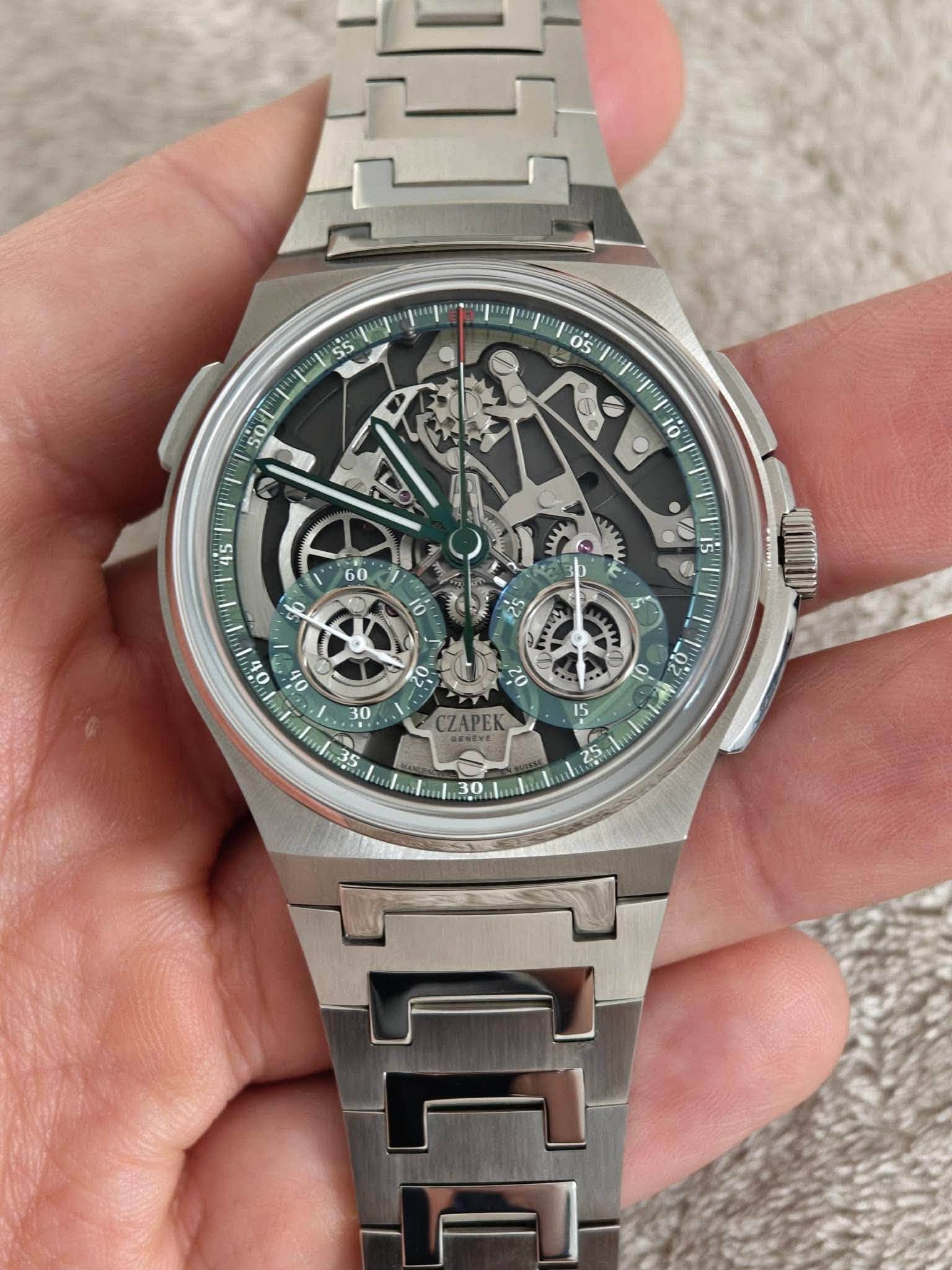 May be an image of wrist watch and text