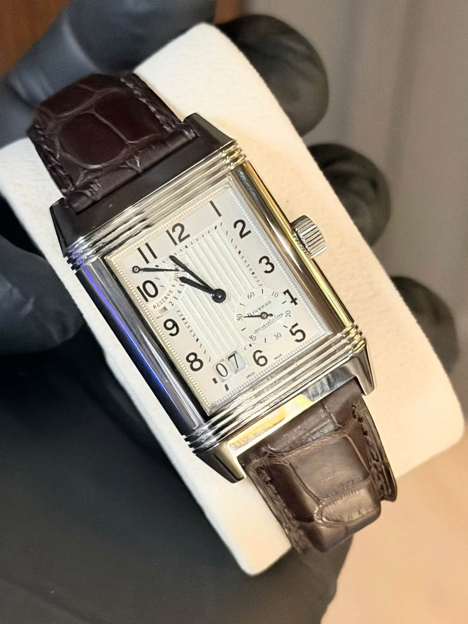 May be an image of wrist watch and text