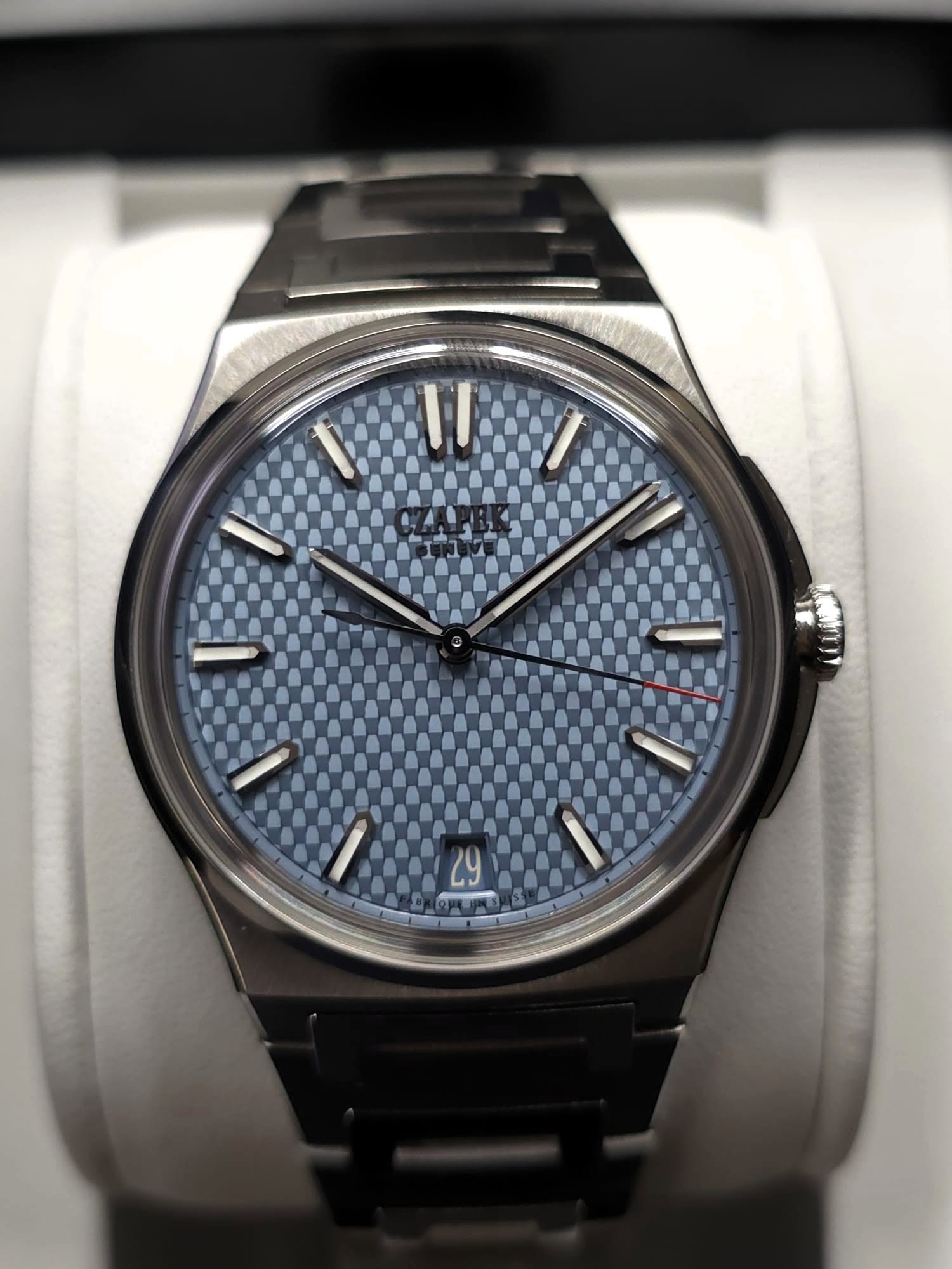 May be an image of wrist watch and text
