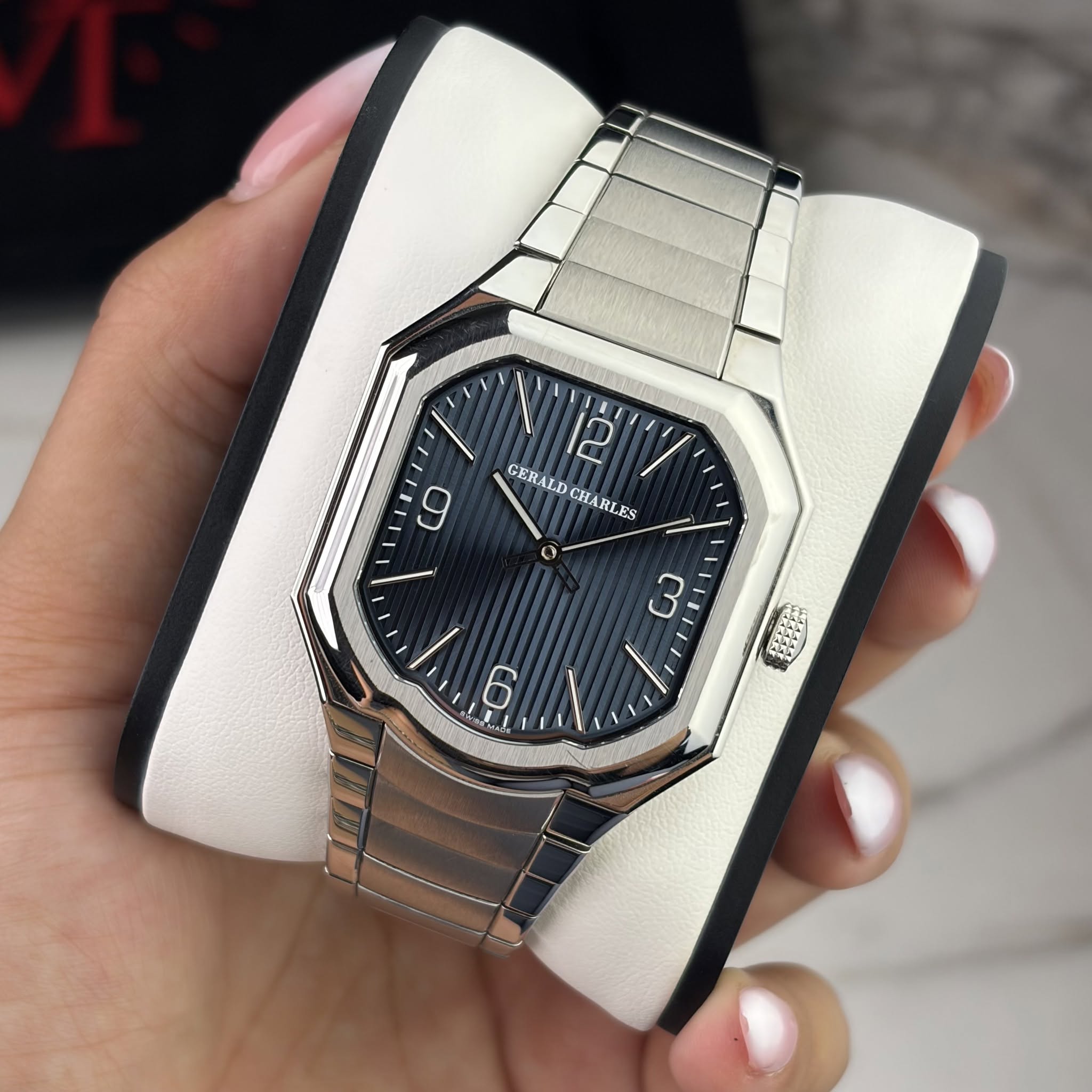 May be an image of wrist watch and text