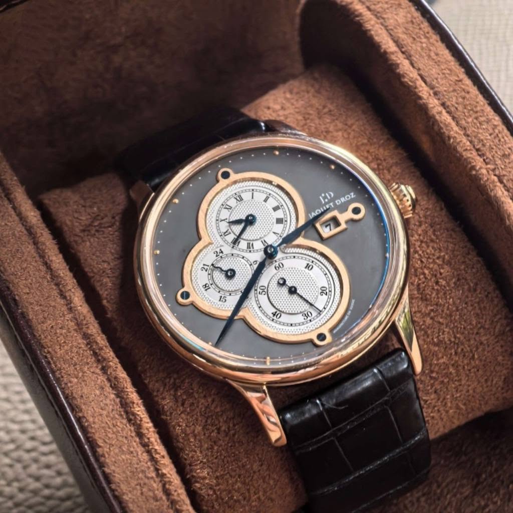 May be an image of wrist watch and text that says 'V XI 1 DROZ JAOUIST 70 7 24 بی S0 60 10 & '