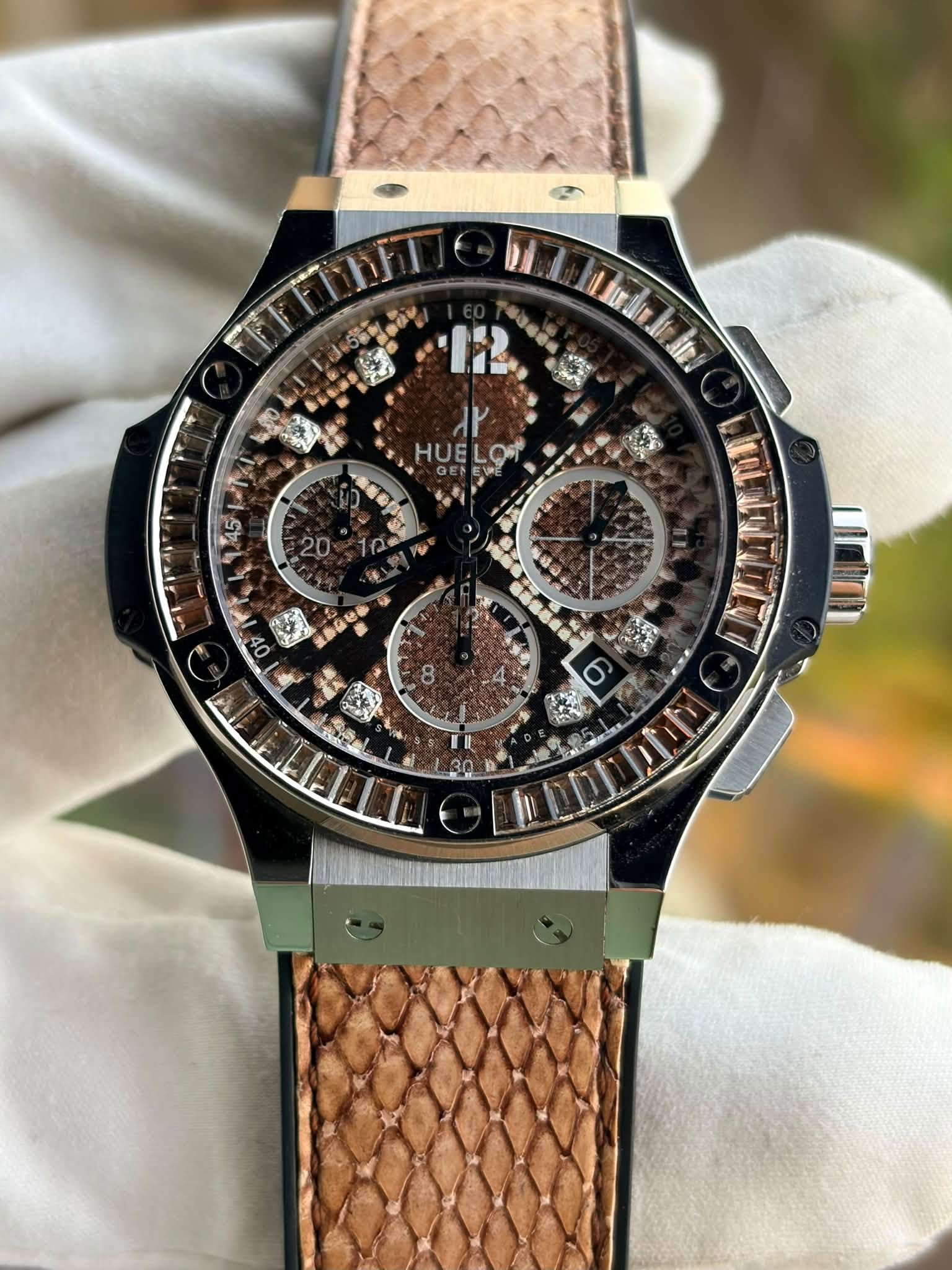 May be an image of wrist watch and text