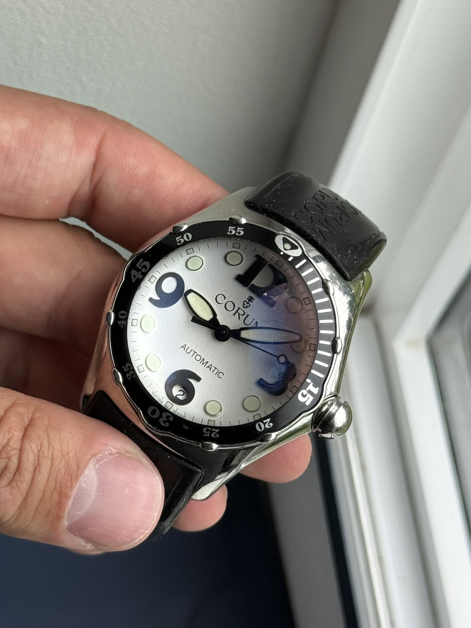 May be an image of digital watch and text
