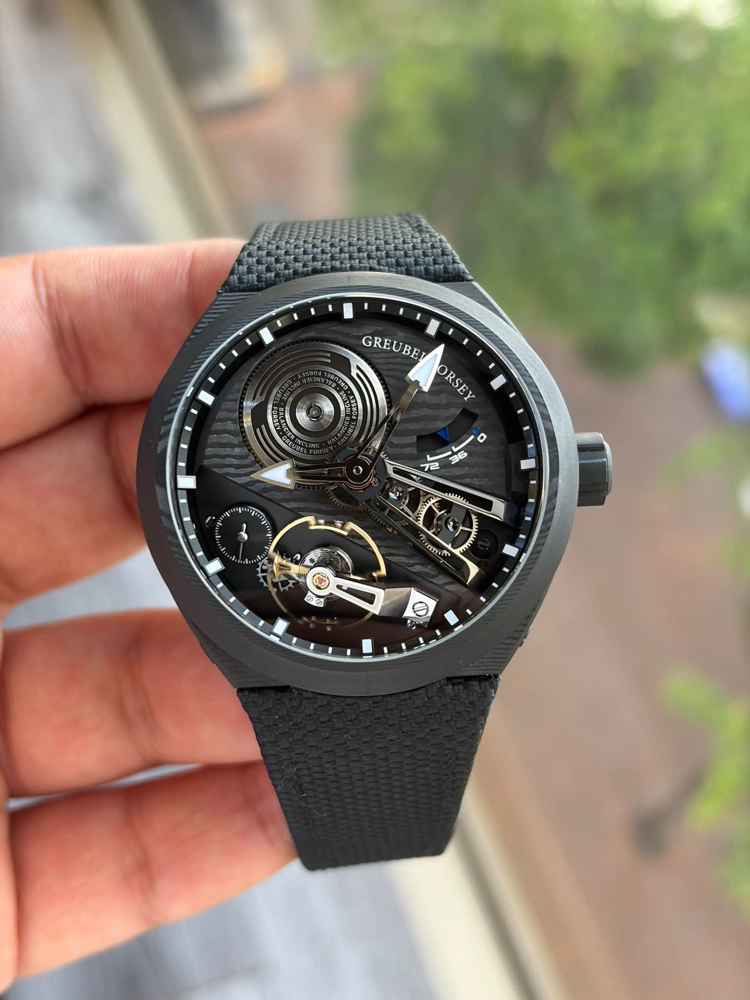 May be an image of wrist watch and text