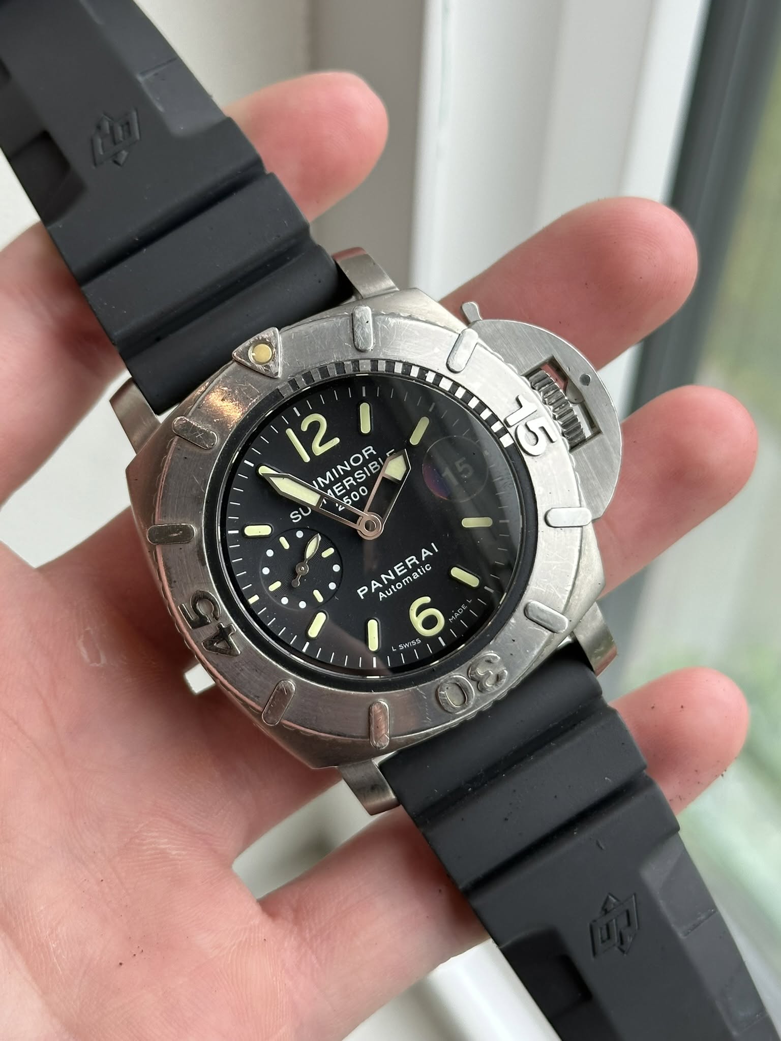 May be an image of wrist watch and text