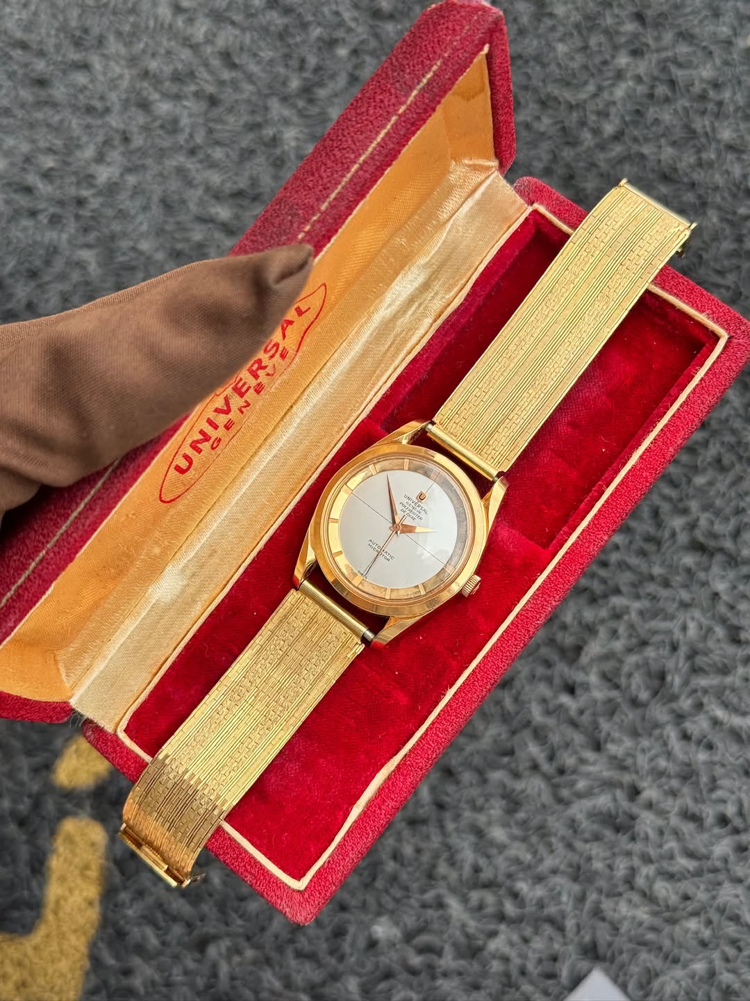 May be an image of wrist watch and text