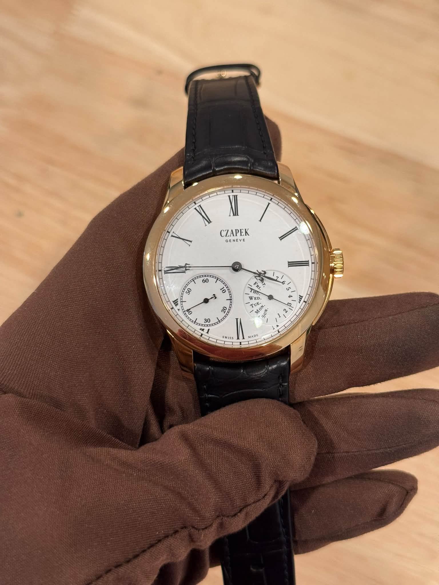 May be an image of wrist watch and text