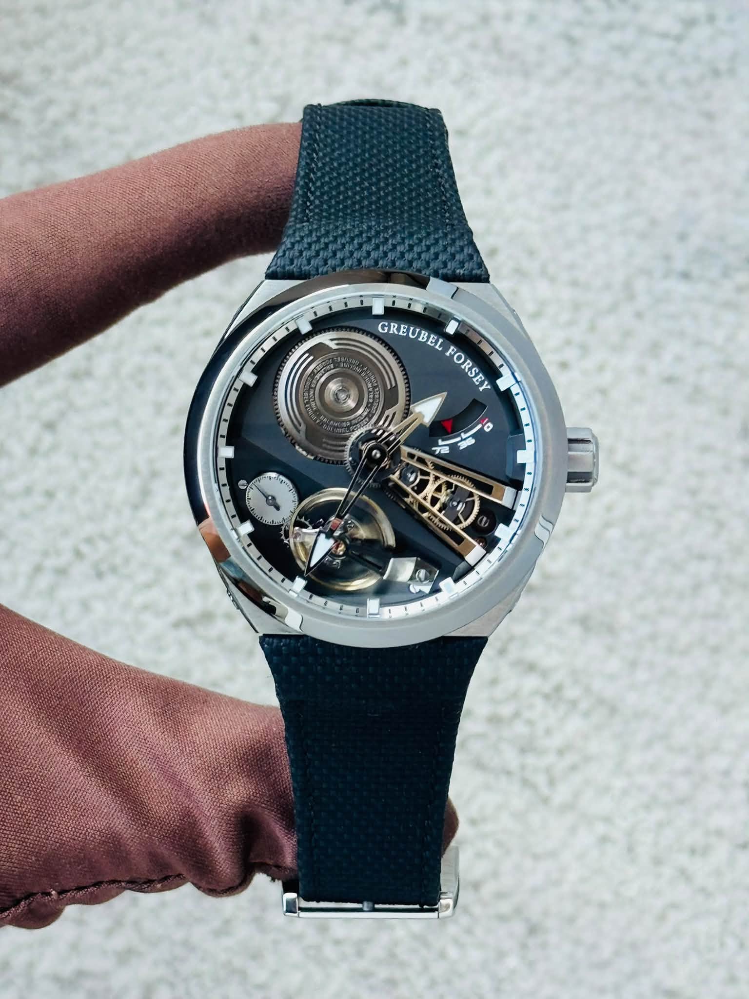 May be an image of wrist watch and text
