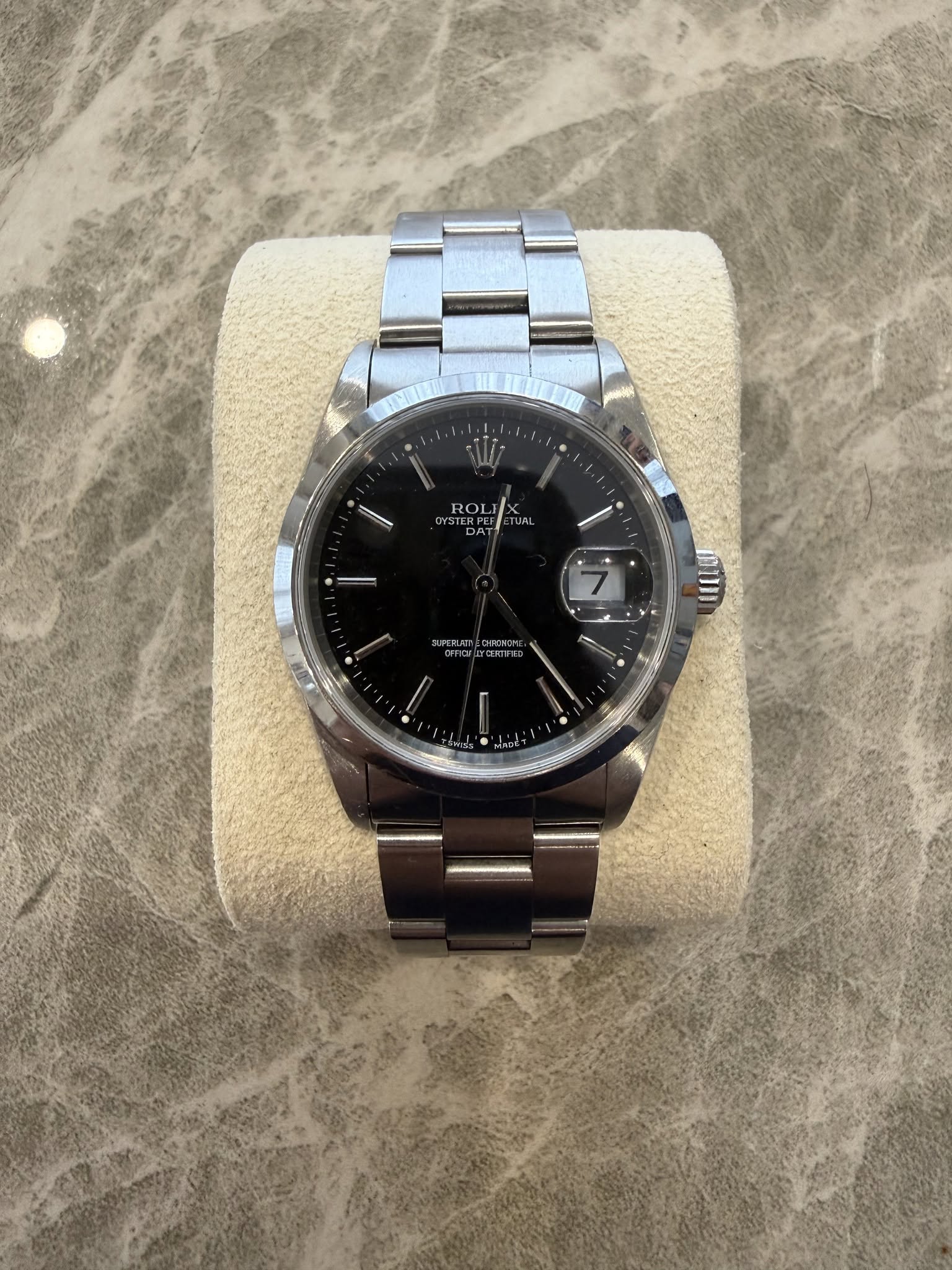 May be an image of wrist watch and text