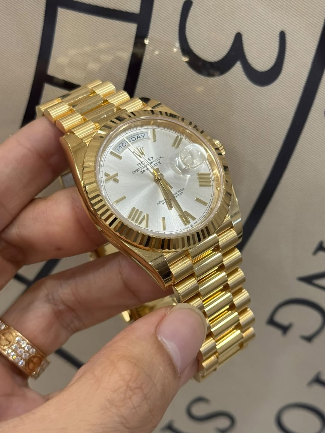 May be an image of wrist watch and text
