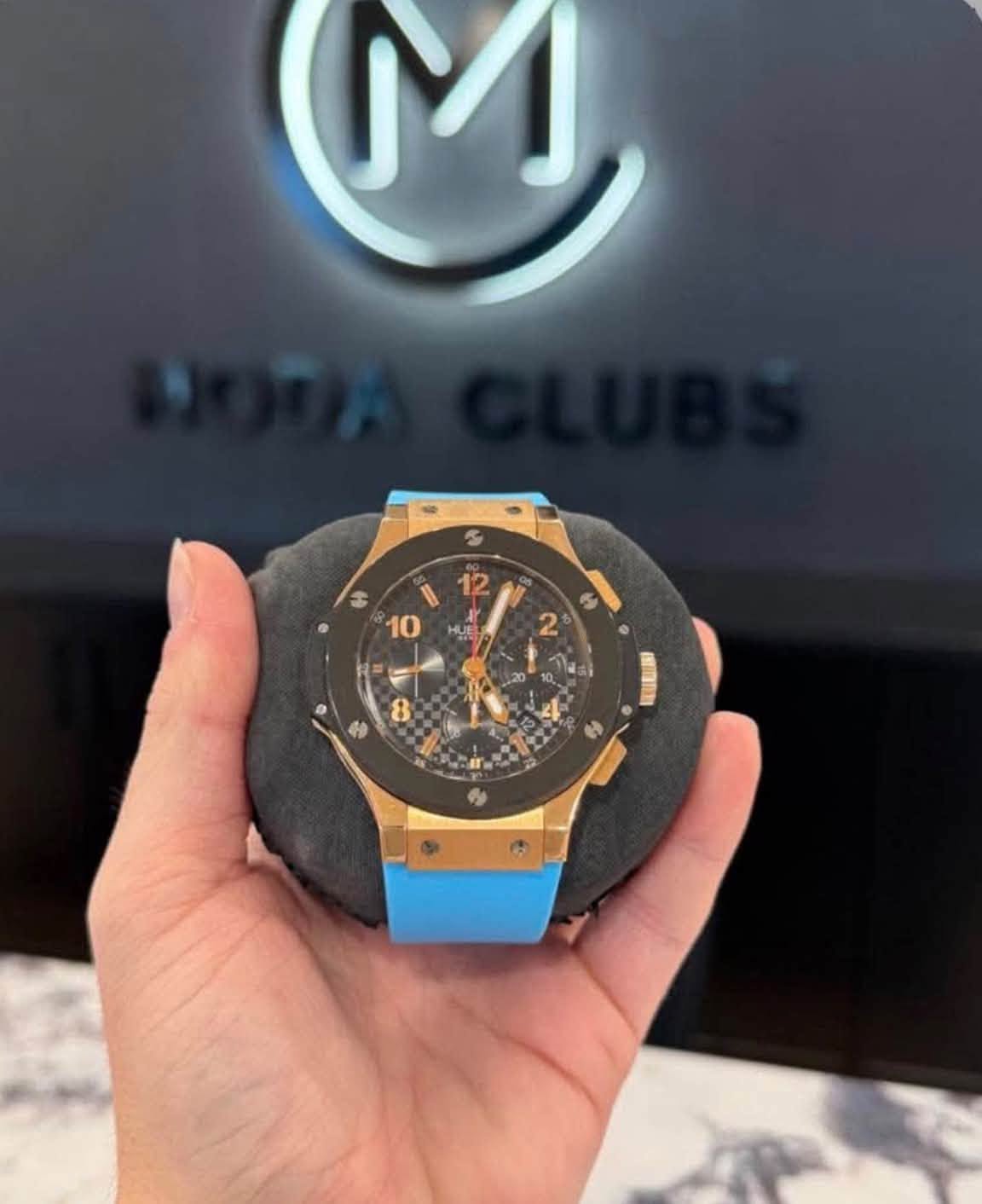 May be an image of wrist watch and text