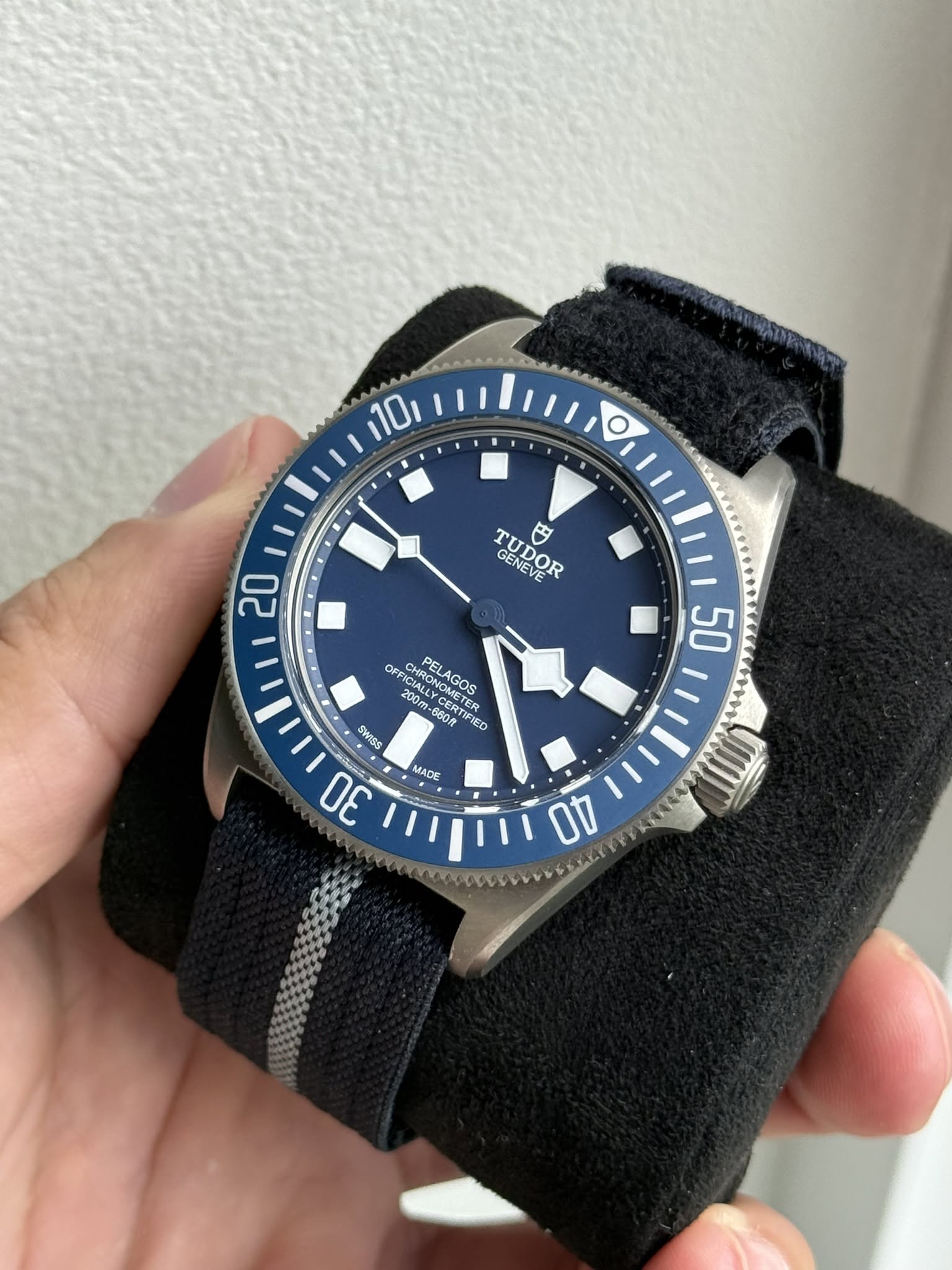 May be an image of wrist watch and text