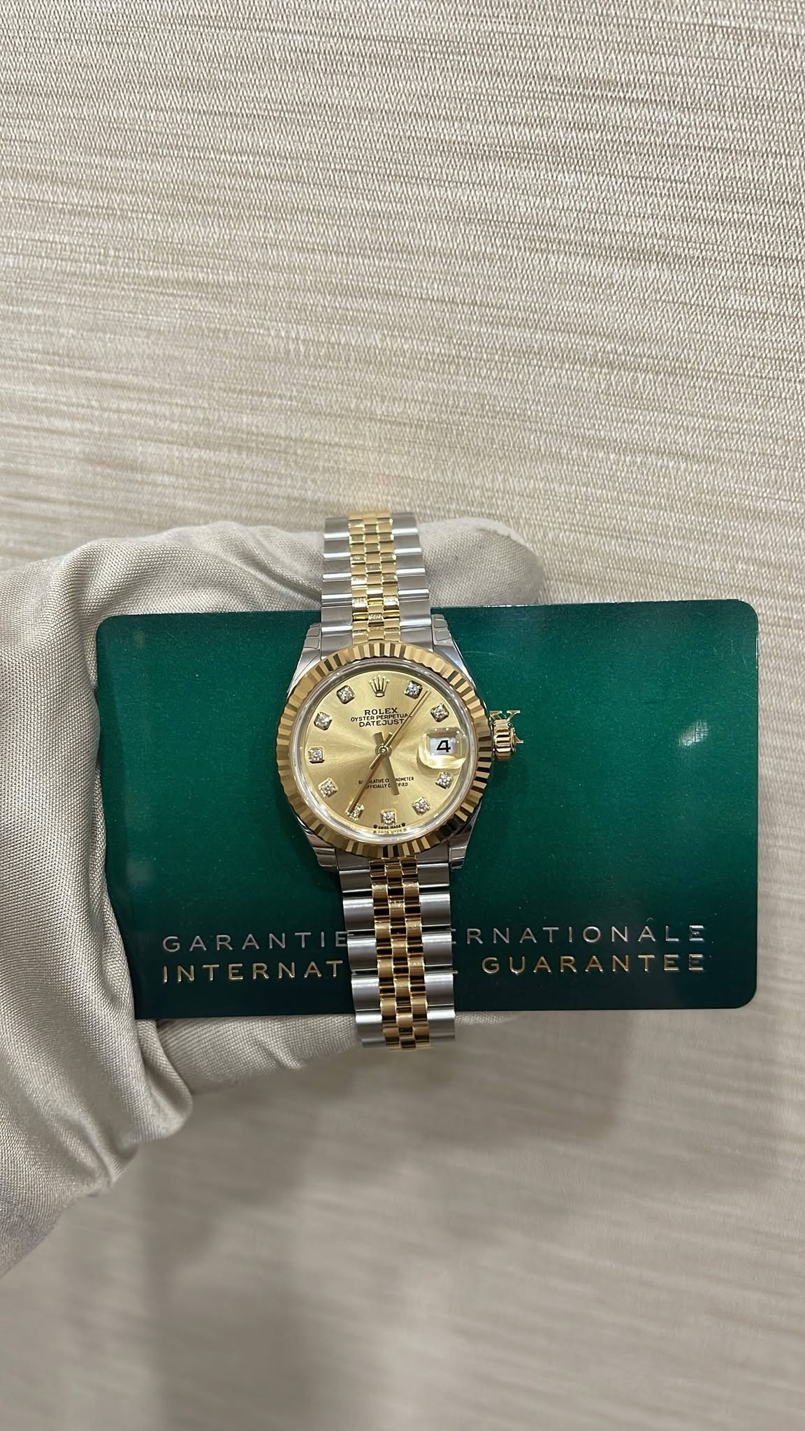 May be an image of wrist watch, jewelry and text