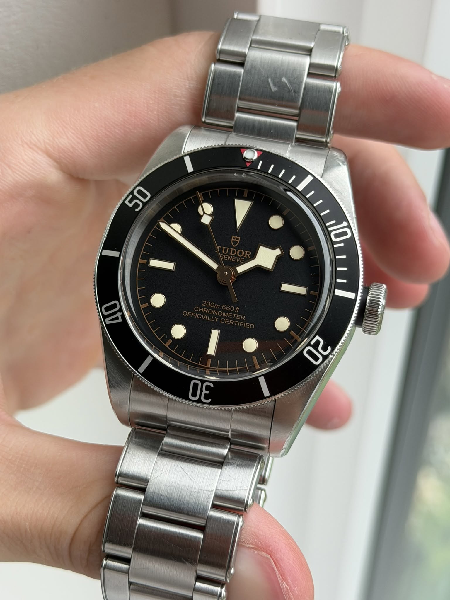 May be an image of wrist watch and text