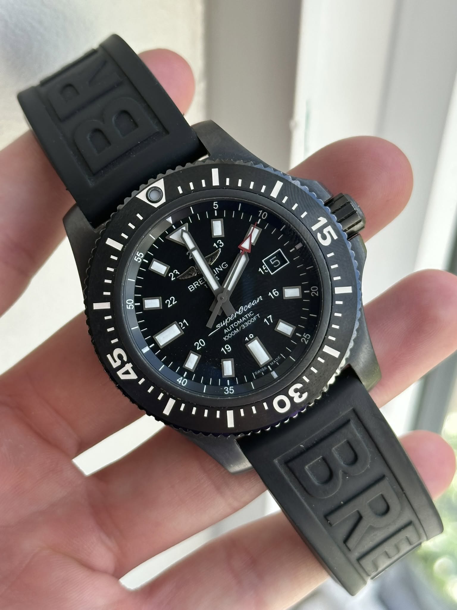 May be an image of wrist watch and text