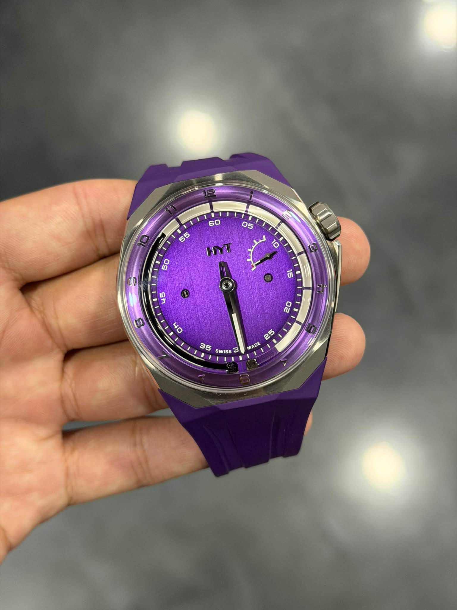May be an image of wrist watch and text