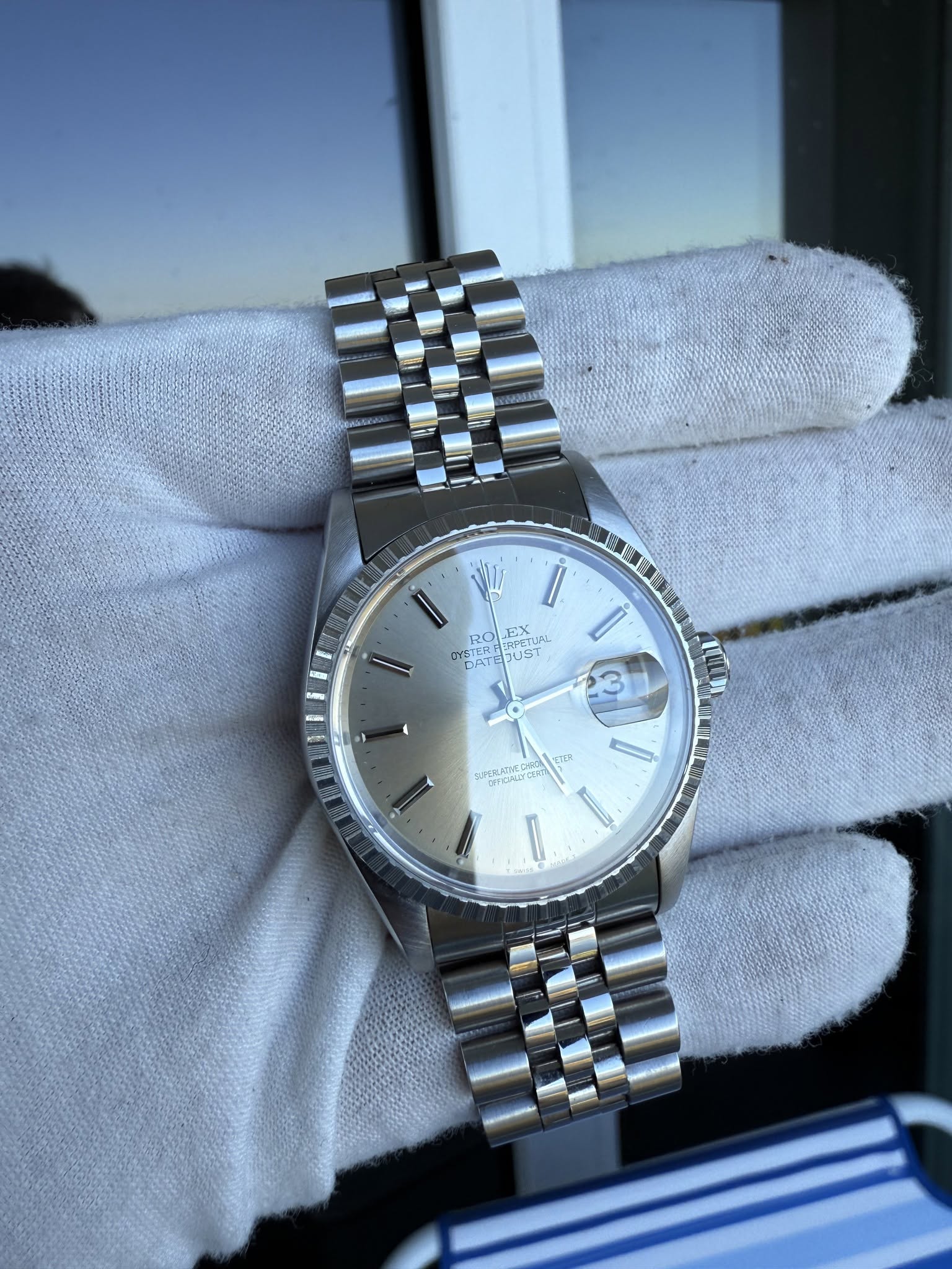 May be an image of wrist watch and text