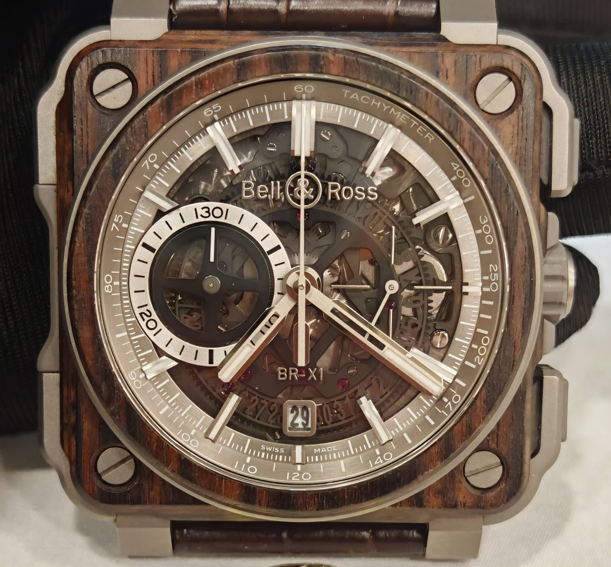 May be an image of wrist watch and text