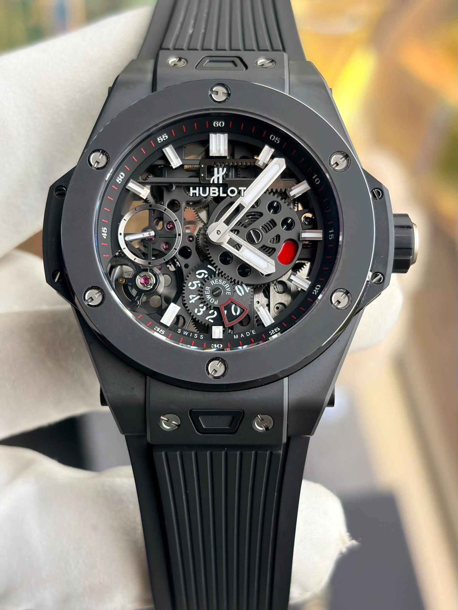 May be an image of wrist watch and text