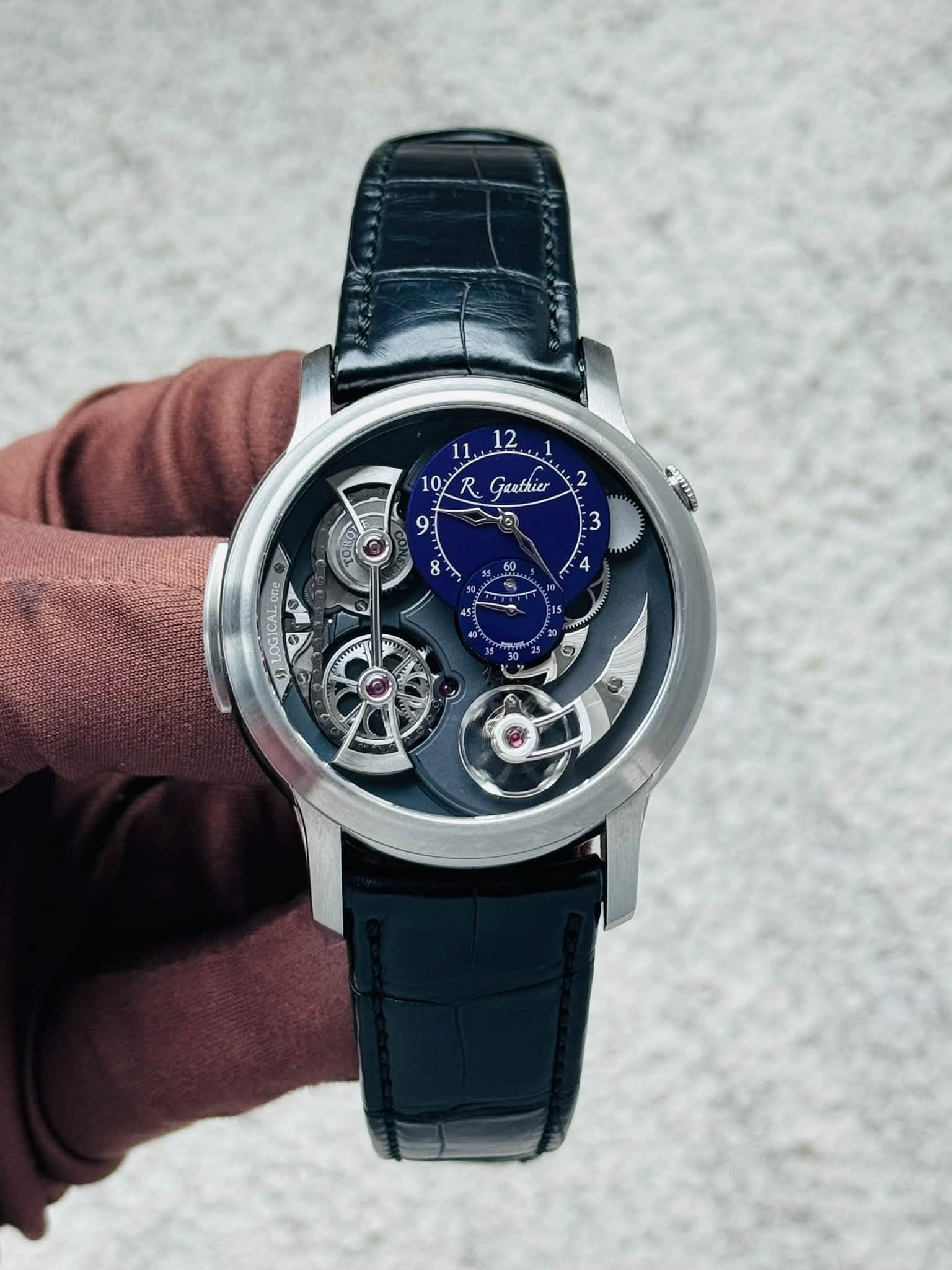 May be an image of wrist watch and text