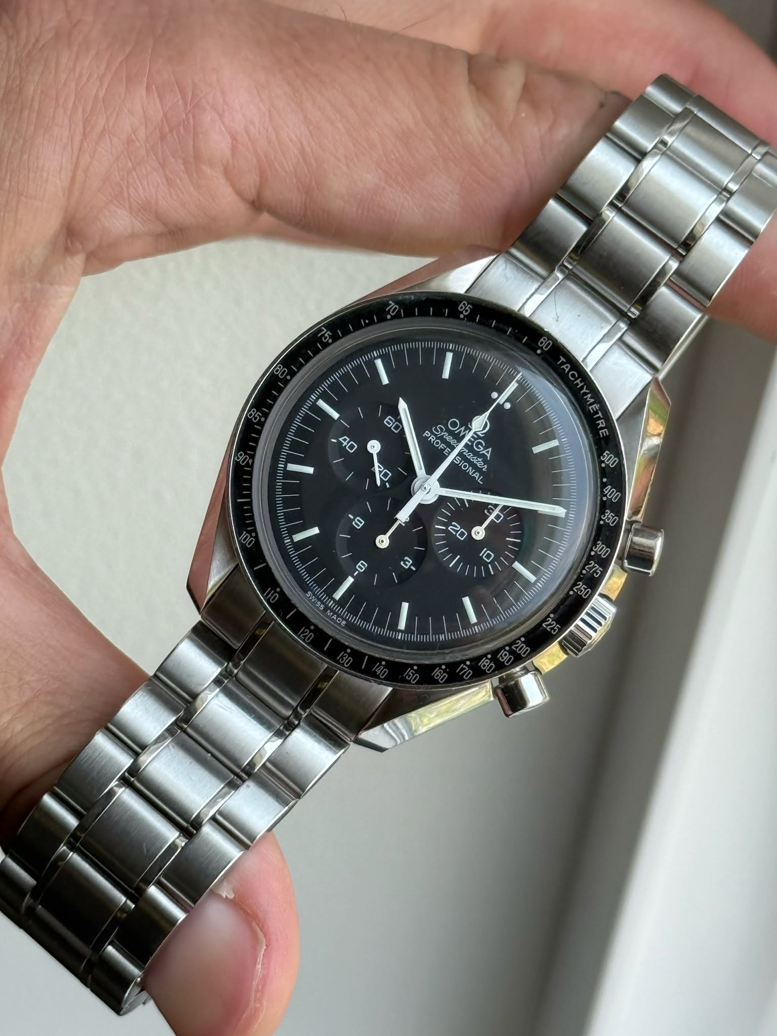May be an image of wrist watch and text
