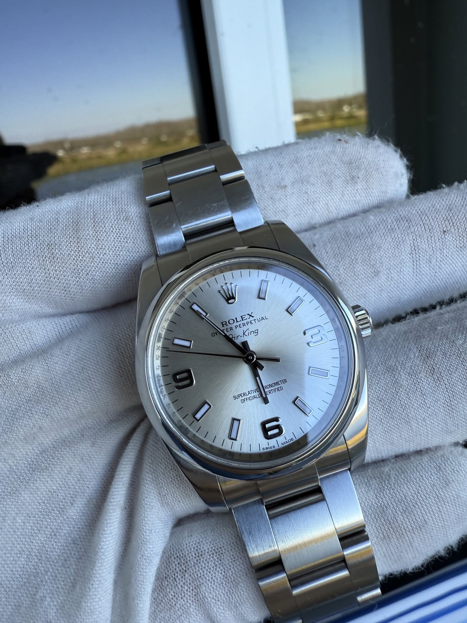 May be an image of wrist watch and text