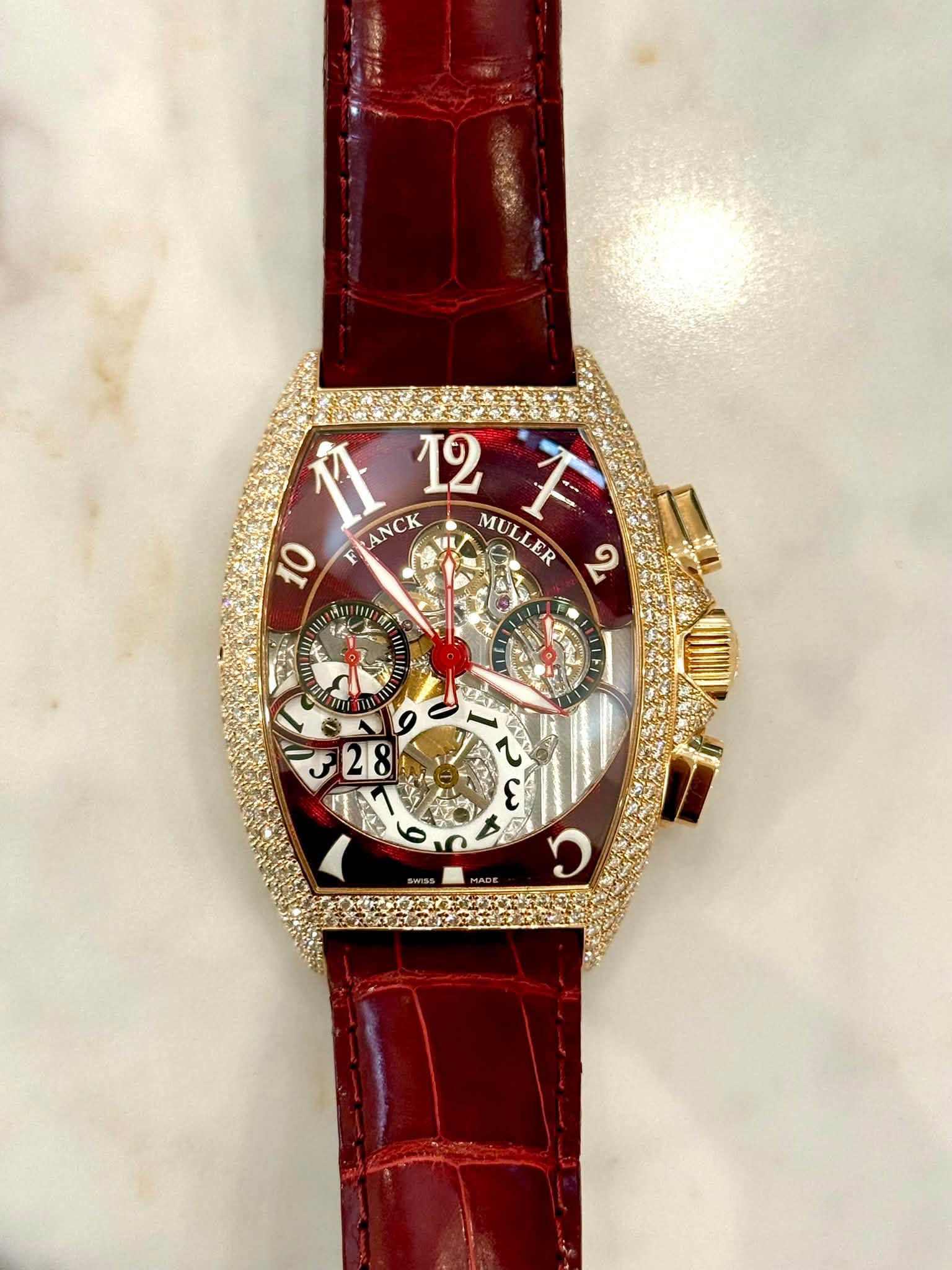 May be an image of wrist watch and text