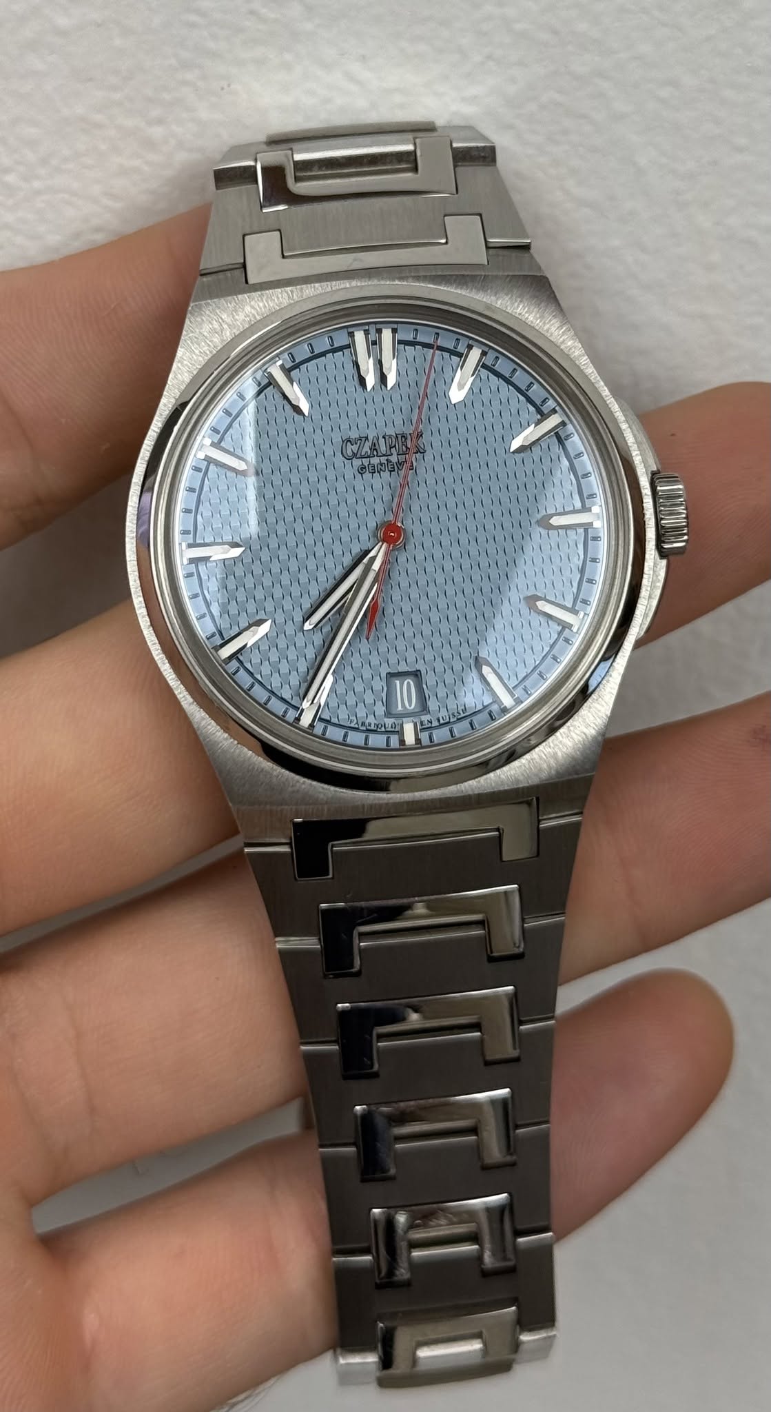 May be an image of digital watch and text