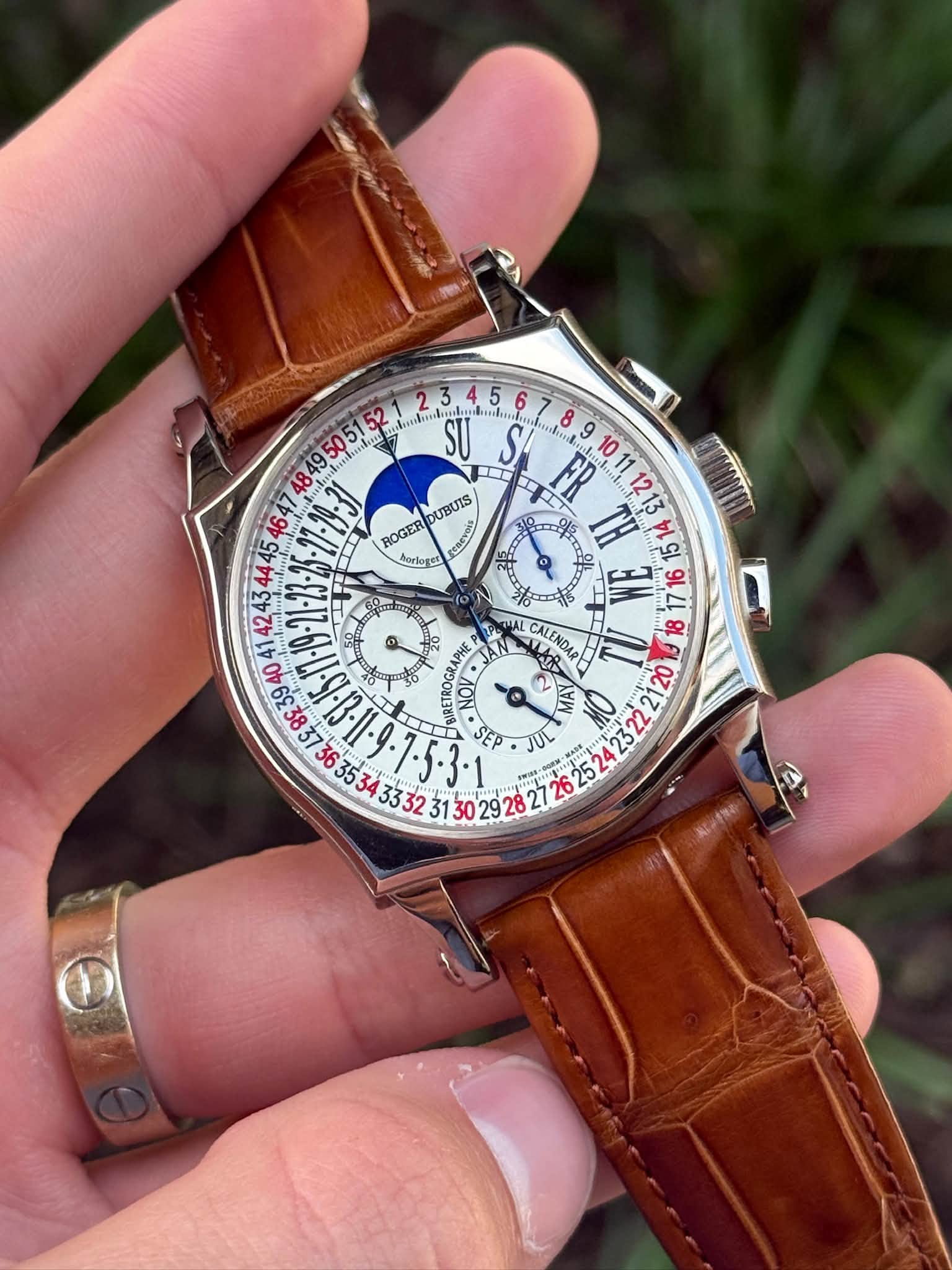 May be an image of wrist watch and text