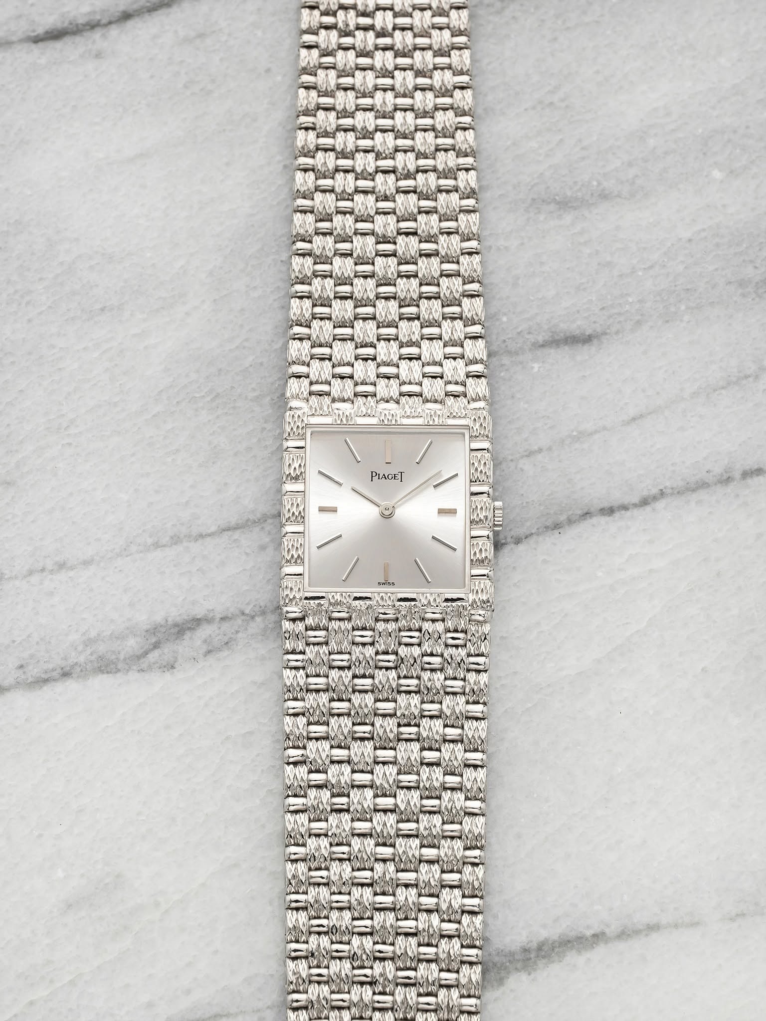 May be an image of wrist watch and jewelry