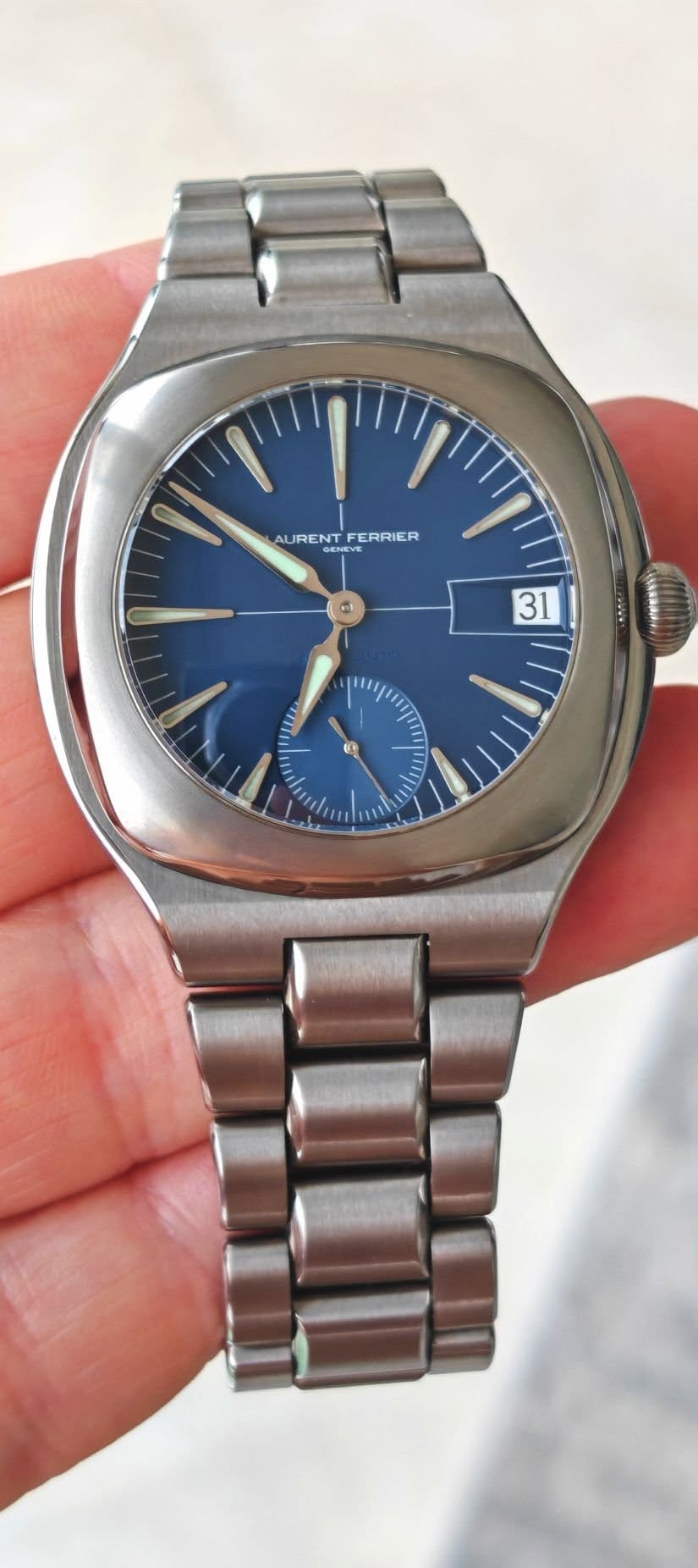 May be an image of wrist watch and text