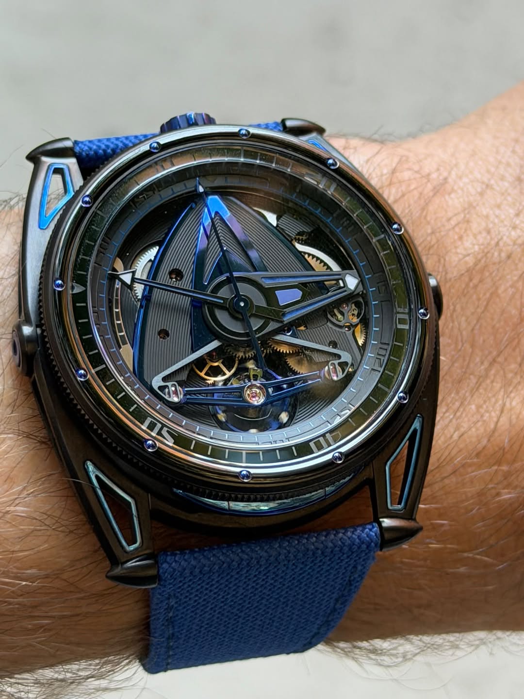 May be an image of wrist watch and text