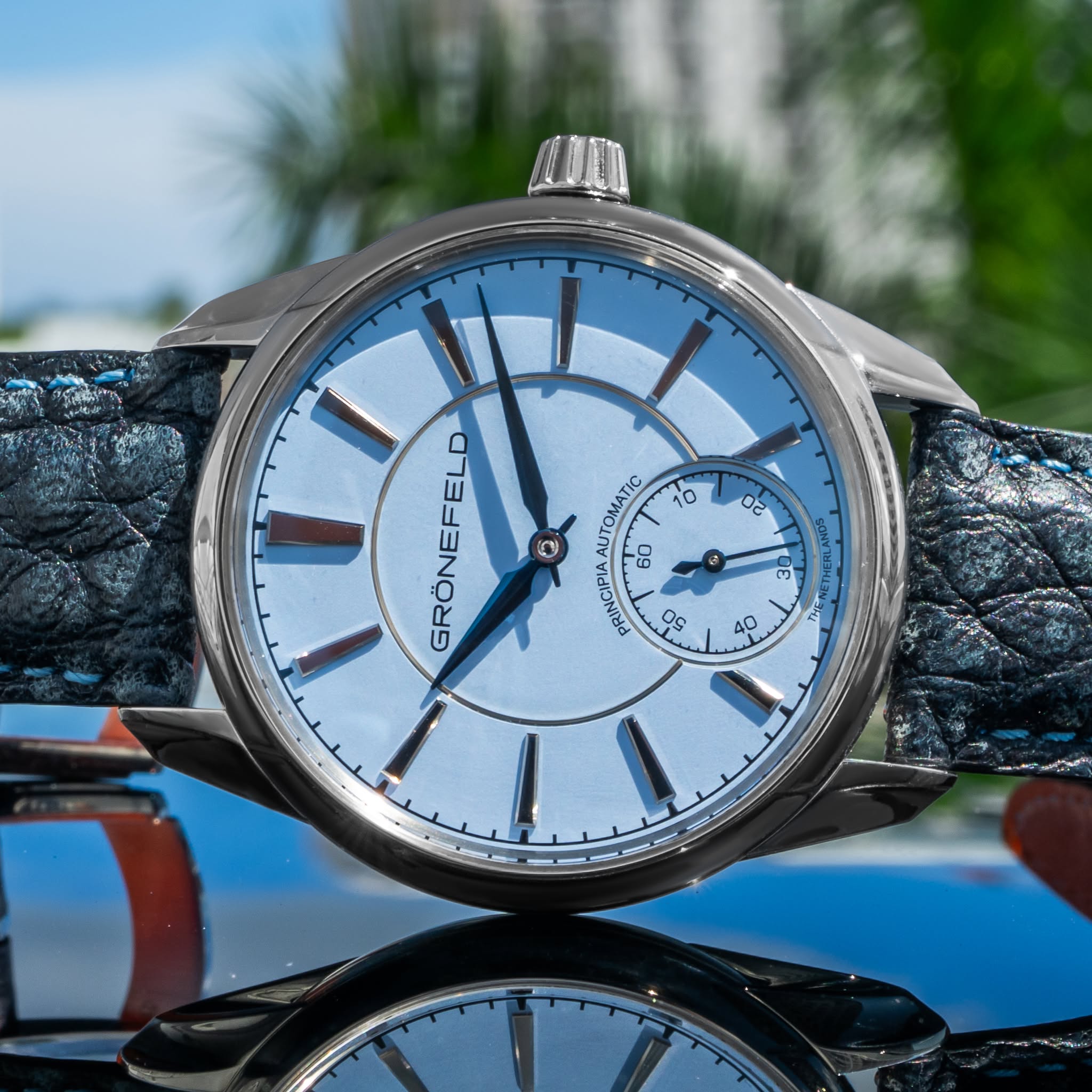May be an image of wrist watch and text
