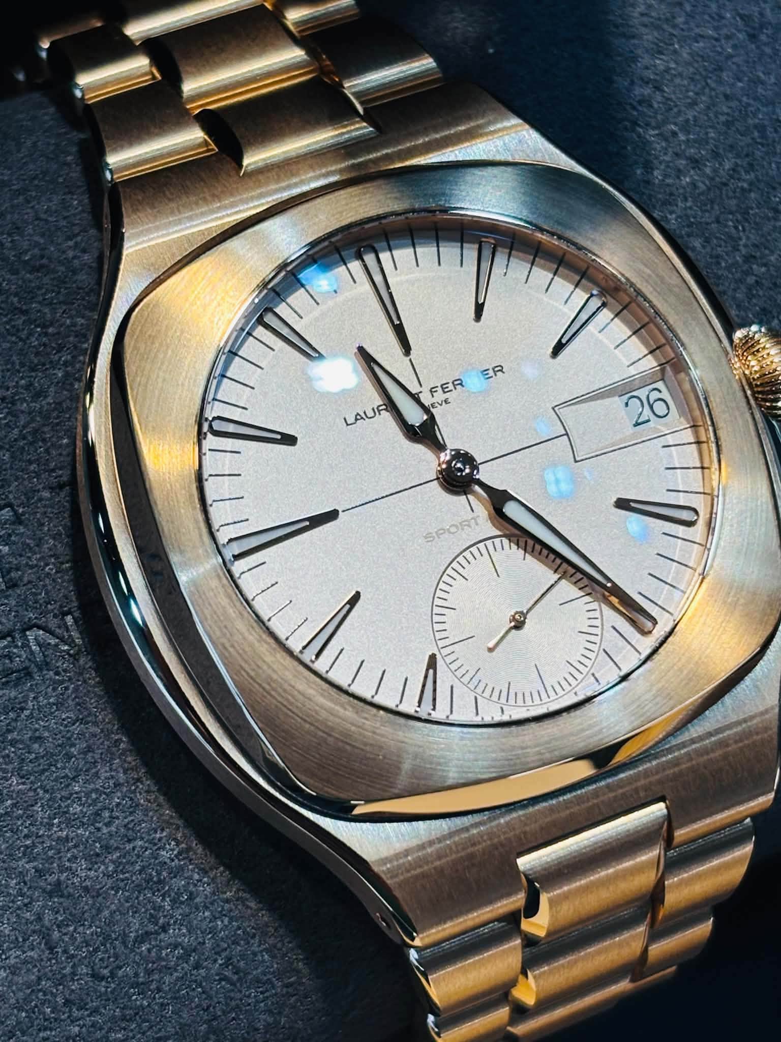 May be an image of wrist watch and text