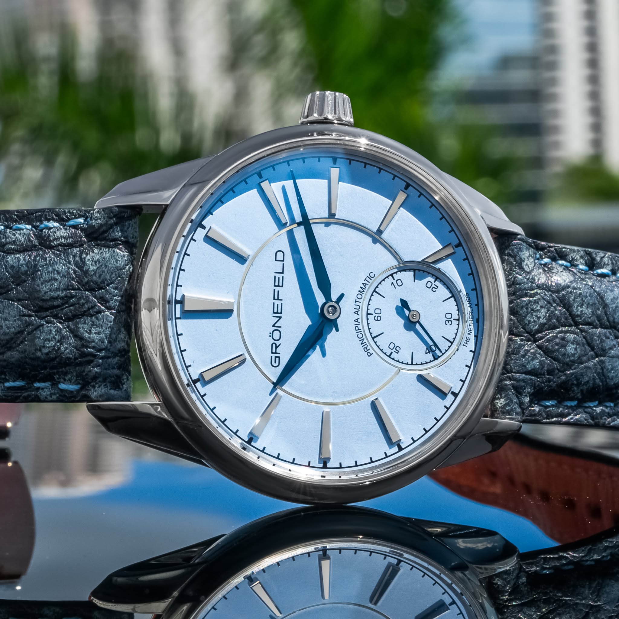 May be an image of wrist watch and text