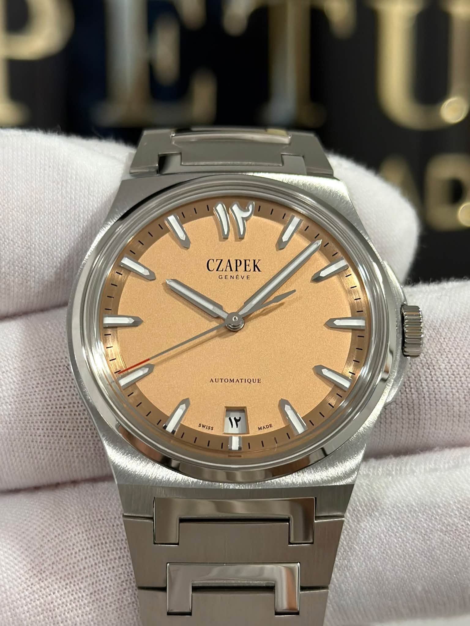 May be an image of wrist watch and text