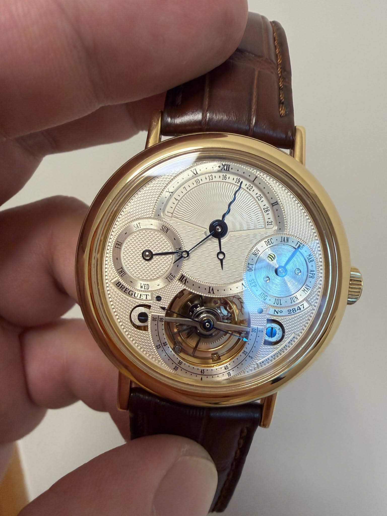May be an image of wrist watch and text