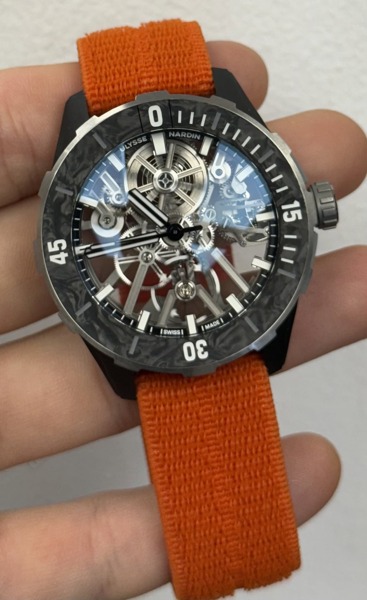 May be an image of wrist watch and text