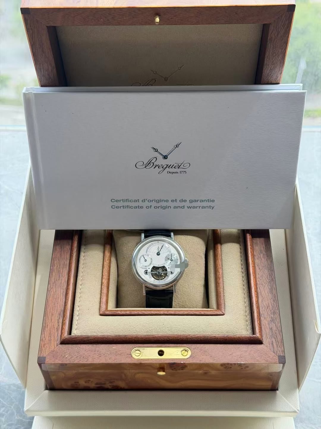May be an image of wrist watch and text