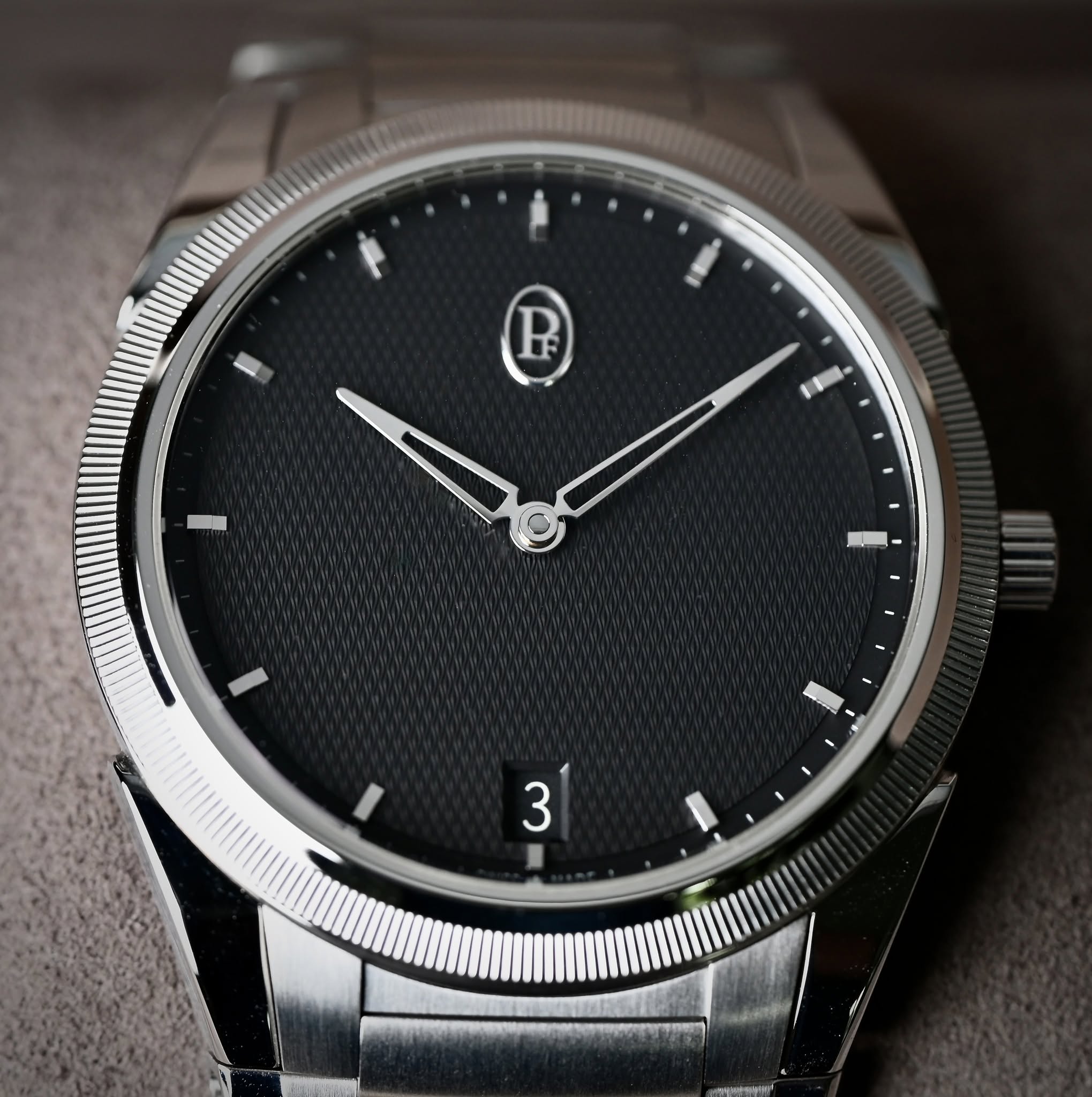 May be an image of wrist watch and text