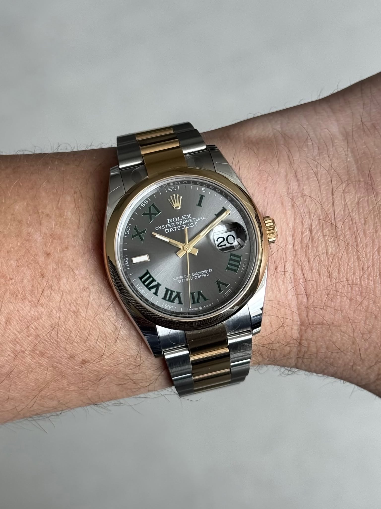 May be an image of wrist watch and text