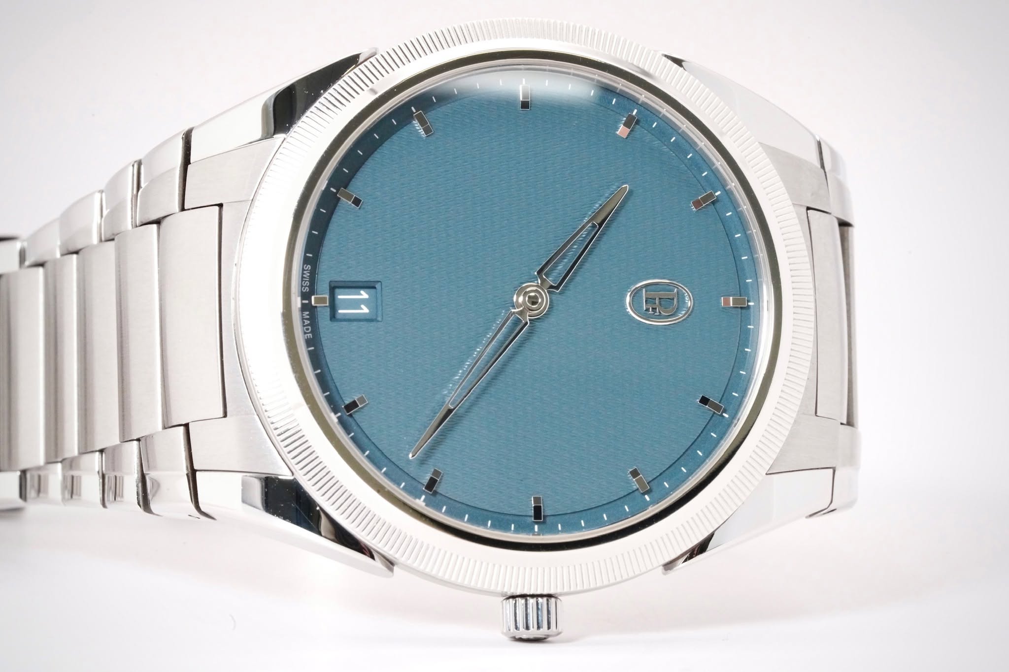 May be an image of wrist watch and text