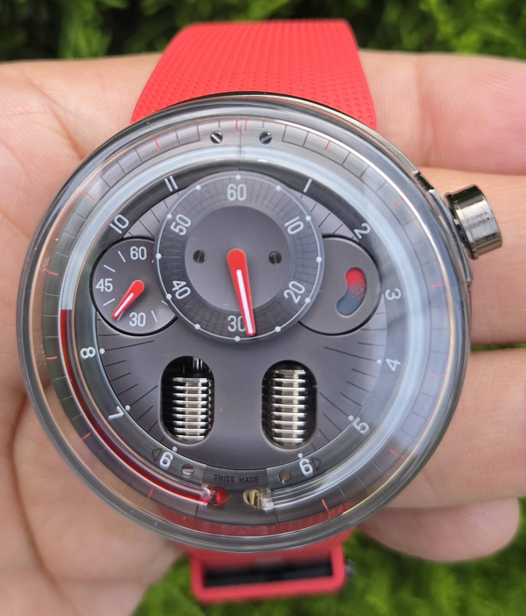May be an image of wrist watch and text
