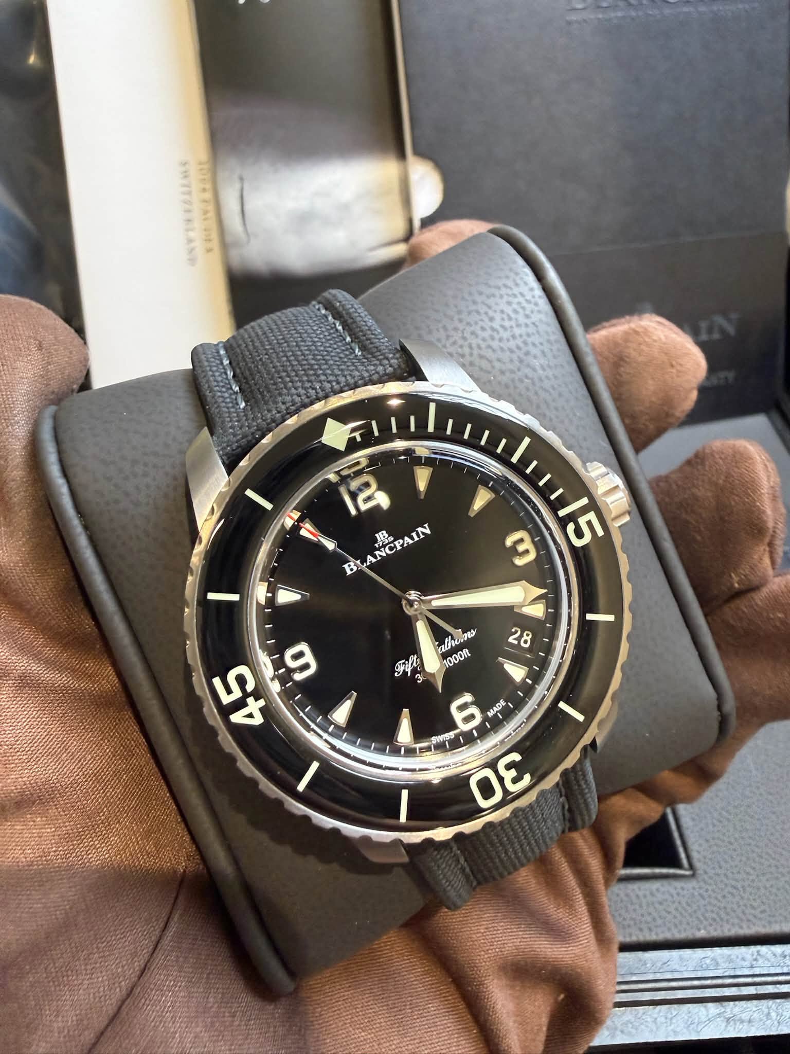 May be an image of wrist watch and text