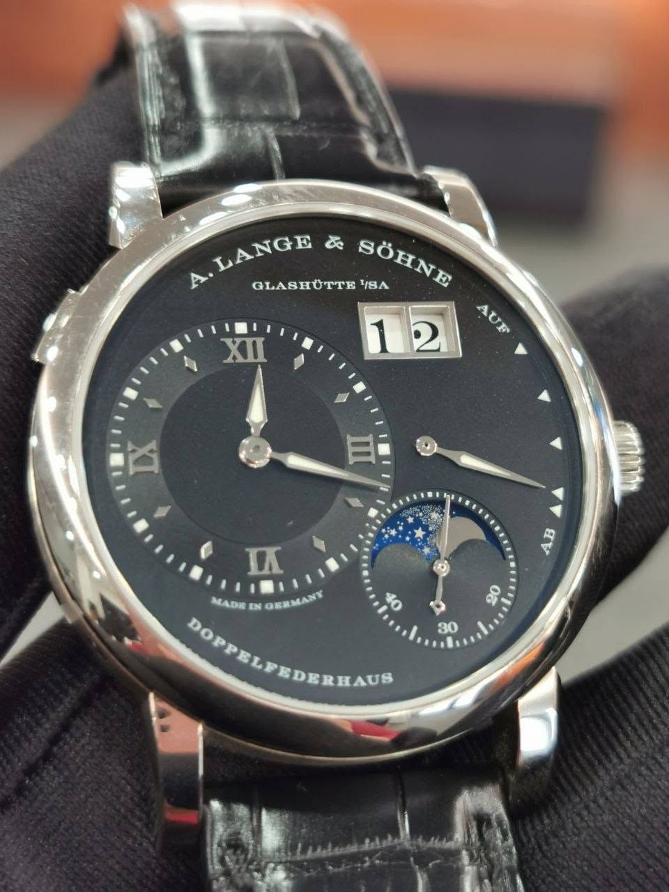 May be an image of wrist watch and text