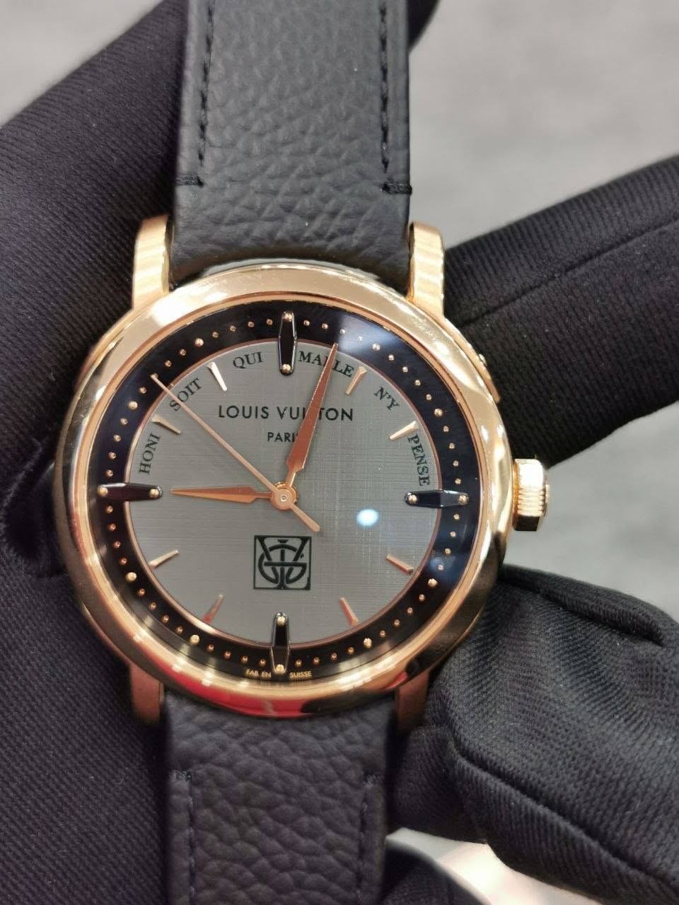 May be an image of wrist watch and text