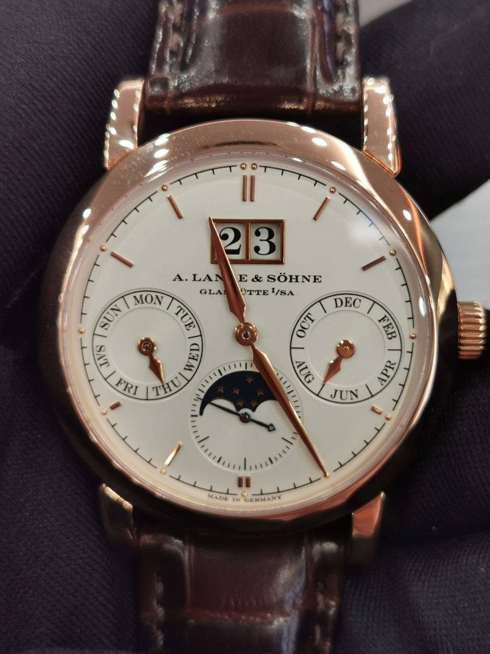 May be an image of wrist watch and text