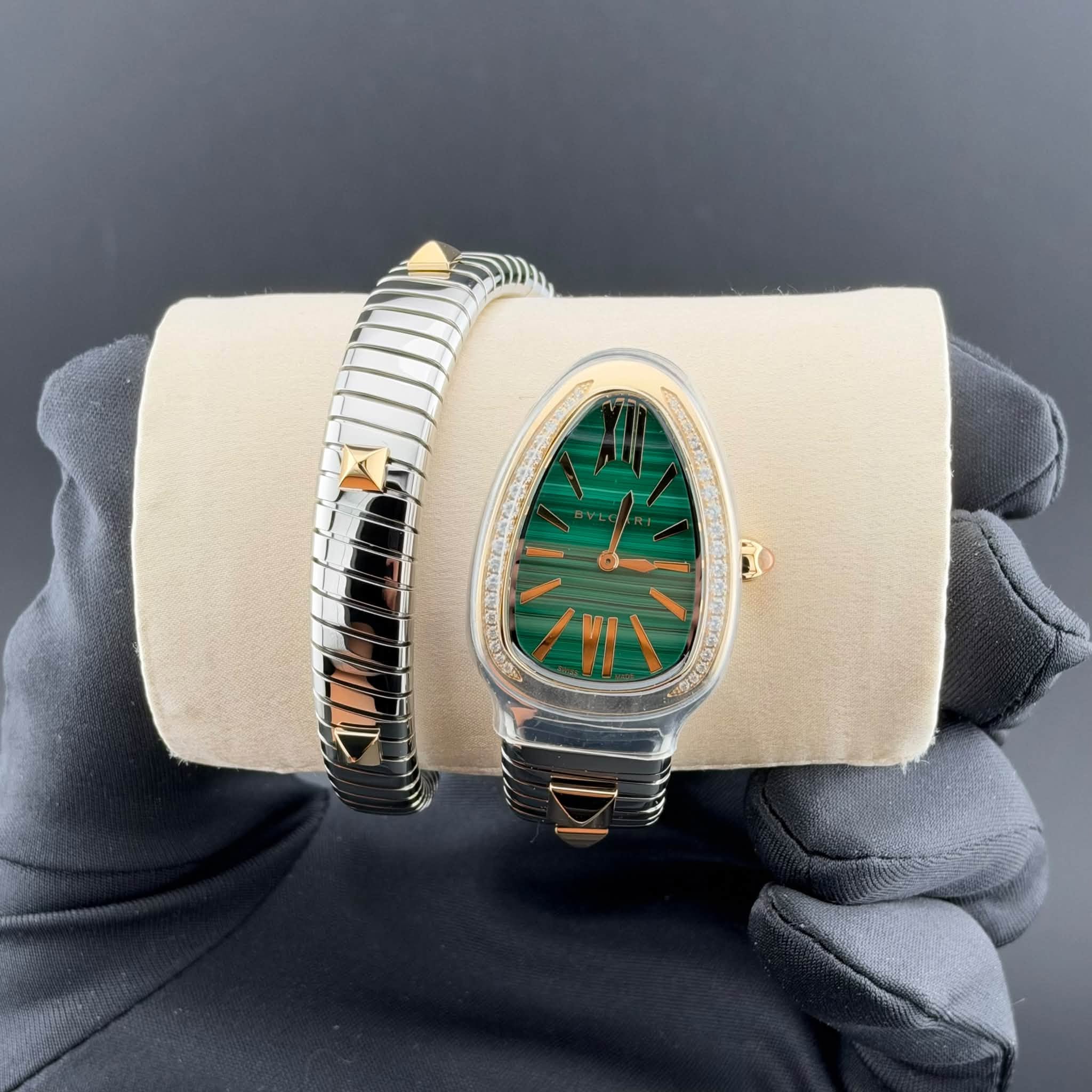 May be an image of wrist watch, jewelry and text