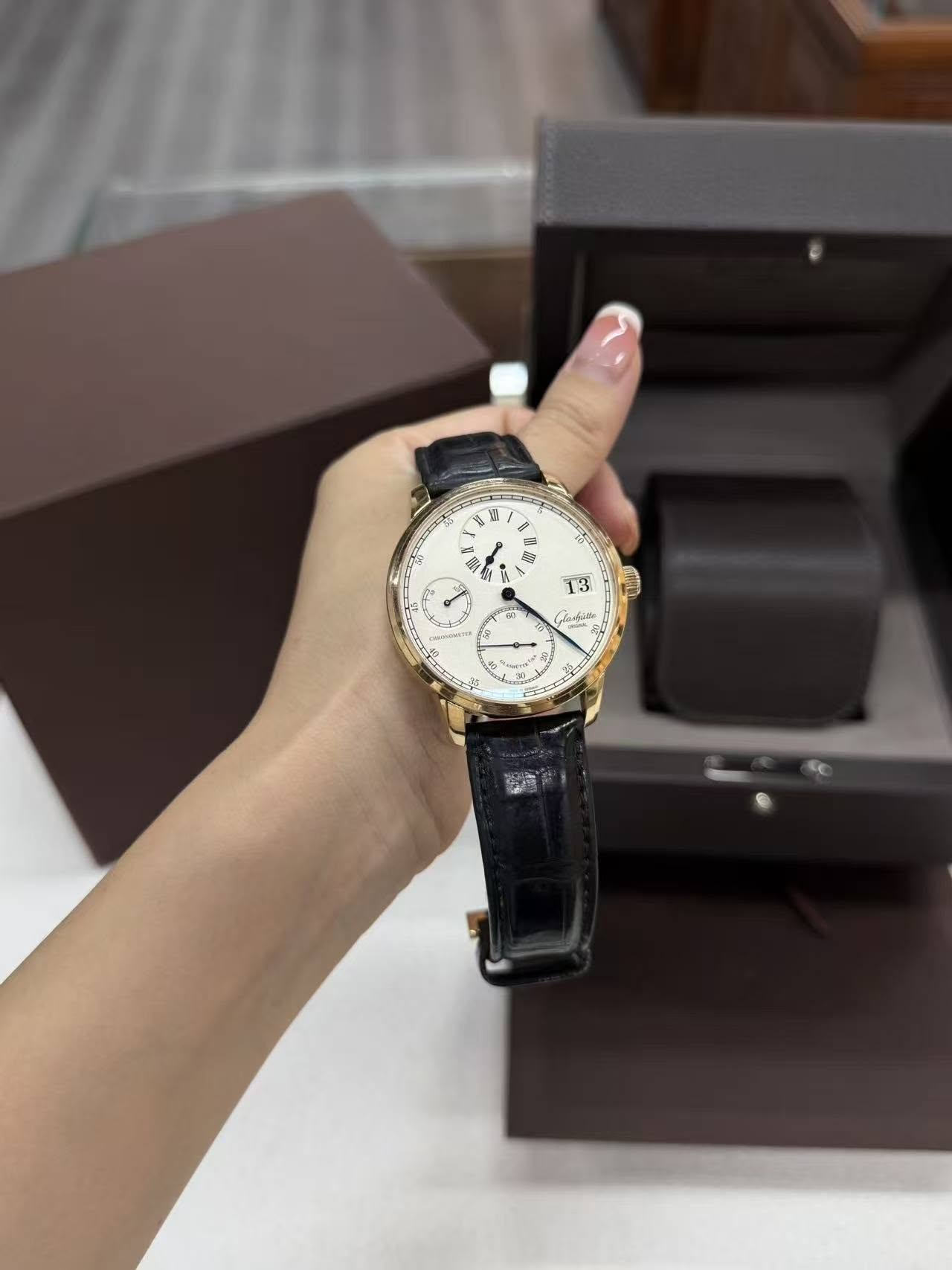 May be an image of wrist watch and text