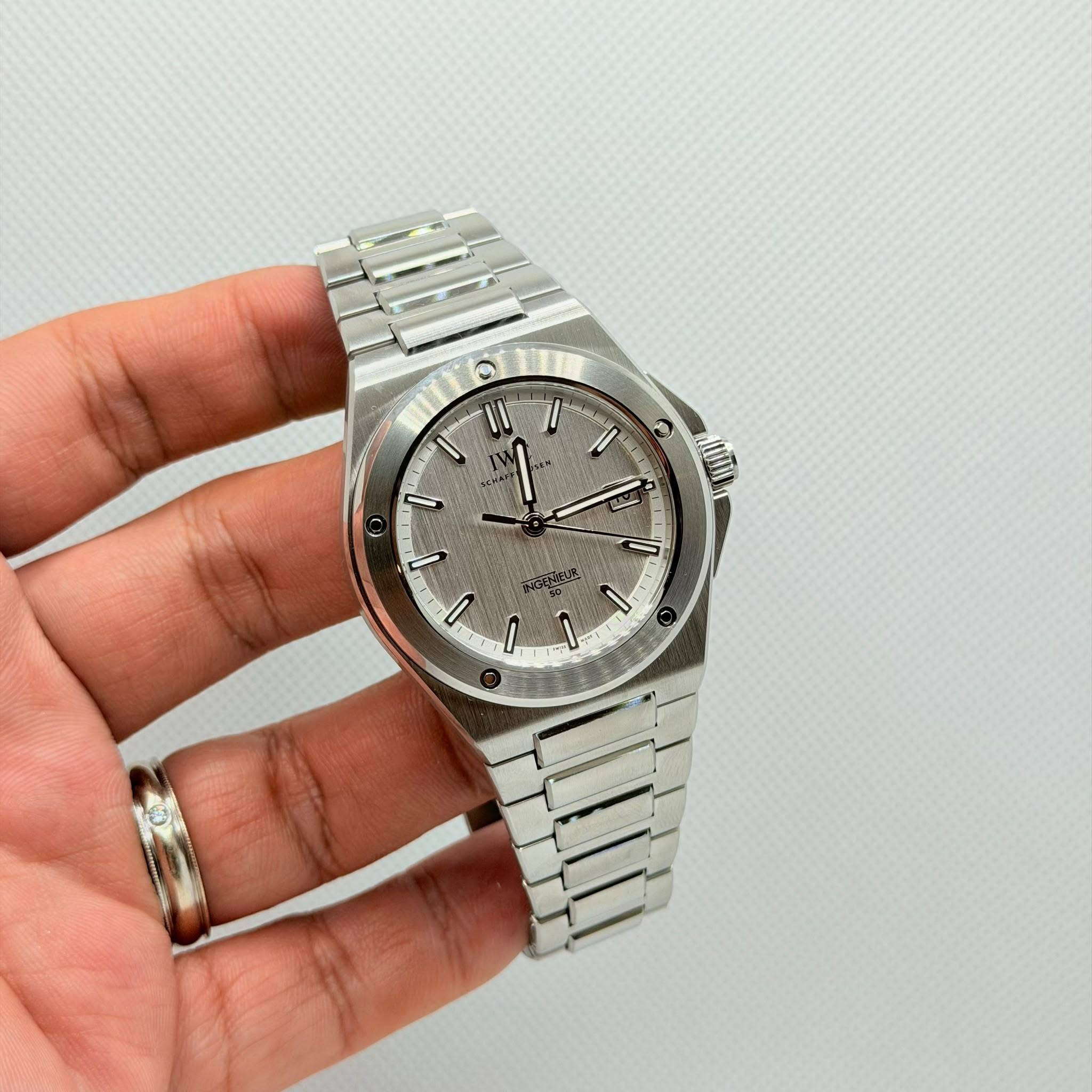 May be an image of wrist watch and text